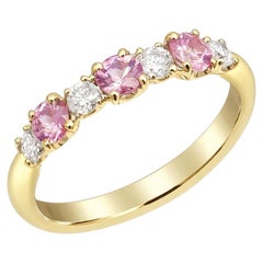 Natural Pink Sapphires 0.57 carats set in 18K Yellow Gold Ring with 0.26 carats