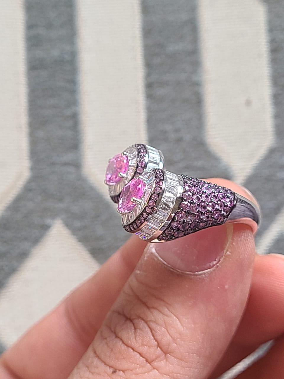 A very gorgeous and one of a kind, Pink Sapphires Cocktail Ring set in 18K White Gold & Diamonds. The weight of the Pink Sapphires is 4.01 carats. The Pink Sapphires are of Madagascar origin. The weight of the Diamonds is 1.34 carats. Net Gold