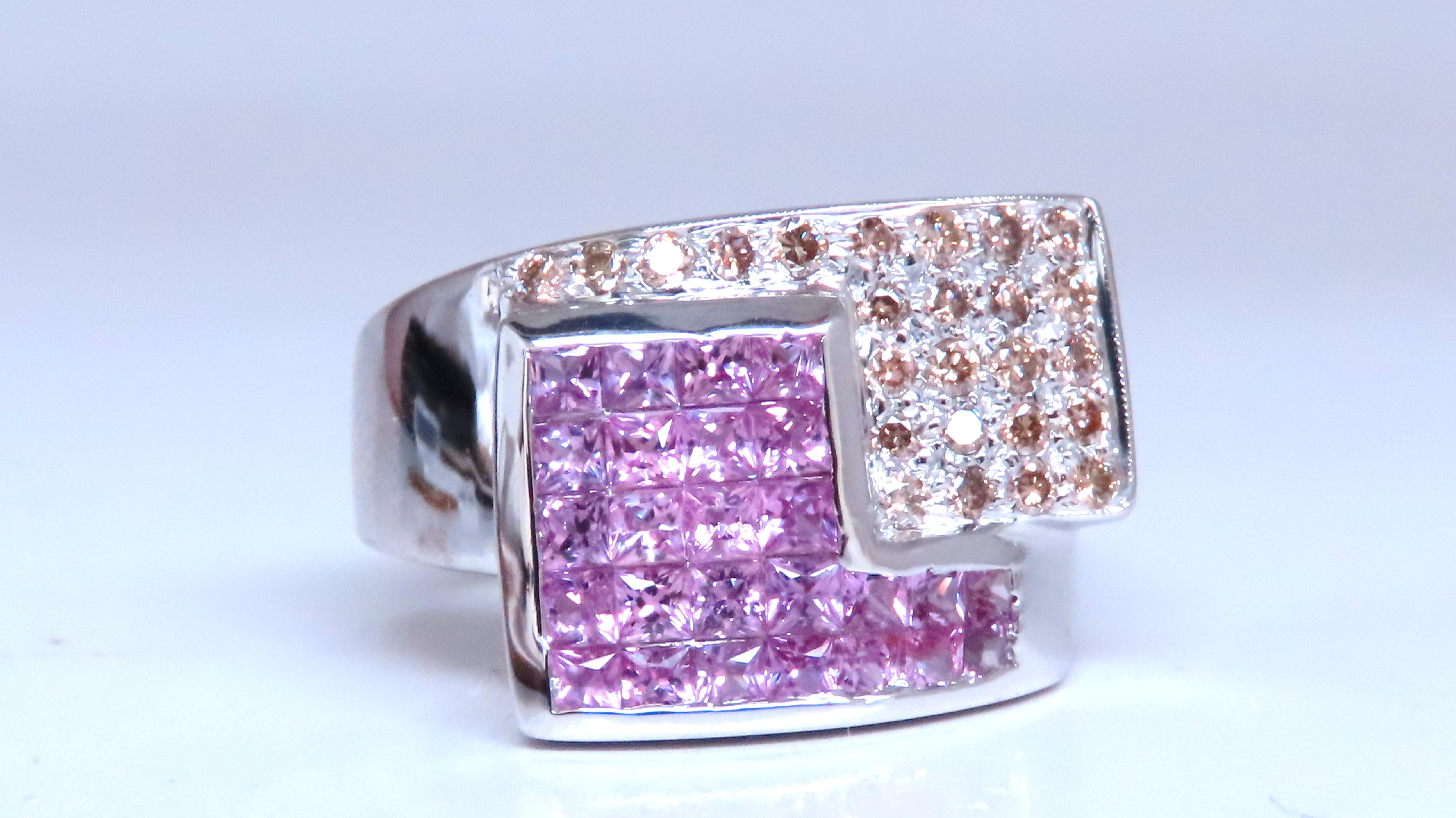 1.10ct Natural Pink sapphires Ring
Mounted in Invisible Set & channel.
Princess Cuts.
CLean Clarity & Transparent.

.60ct Natural Fancy Brown Diamonds.
14kt. white gold
9.4 Grams

14mm wide ring
Depth: 5.1mm

Size 7

$4000 Appraisal to accompany