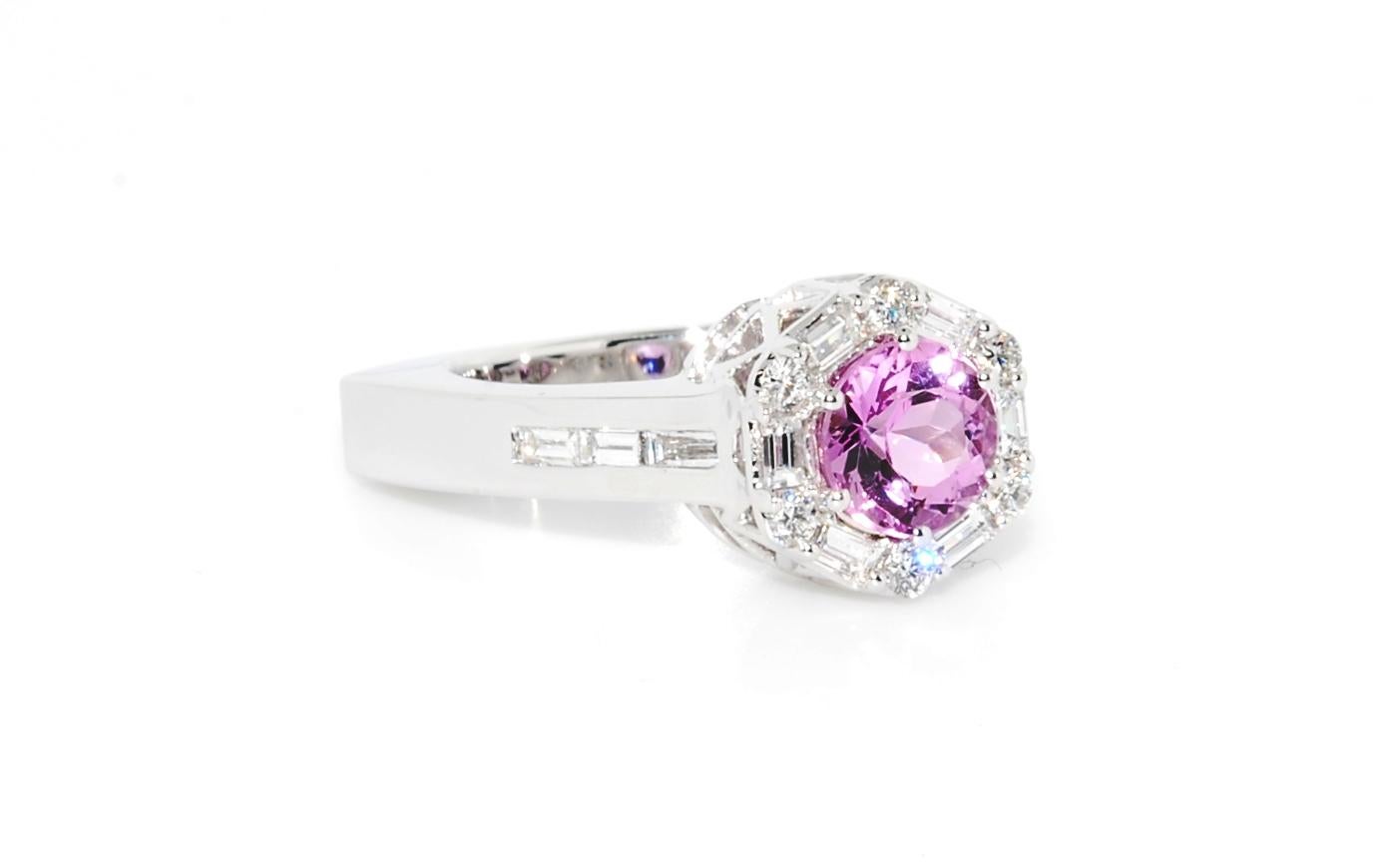 One of one by Erica Sanchez-Hawkins. Fantastic Natural pink Topaz - this can be a unique engagement ring or a beautiful fashion piece. The Topaz weighs 1.41 carats and it is surrounded in a diamond halo that features both baguettes and round full