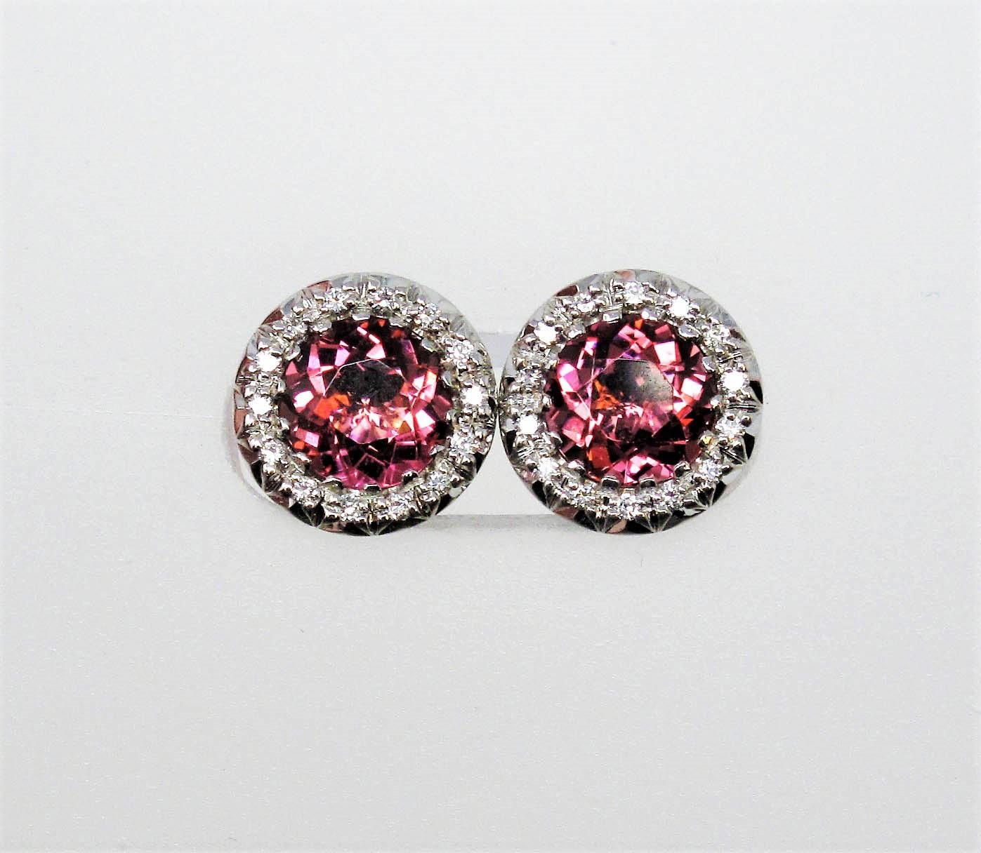These incredible tourmaline and diamond halo studs offer substantial sparkle and glamour without being over the top, while their simple yet elegant design can be worn with just about anything. The incredible rich pink color of the tourmaline really