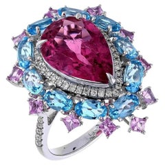 Anello con tormalina rosa naturale, topazio blu e zaffiro rosa in oro 18 carati