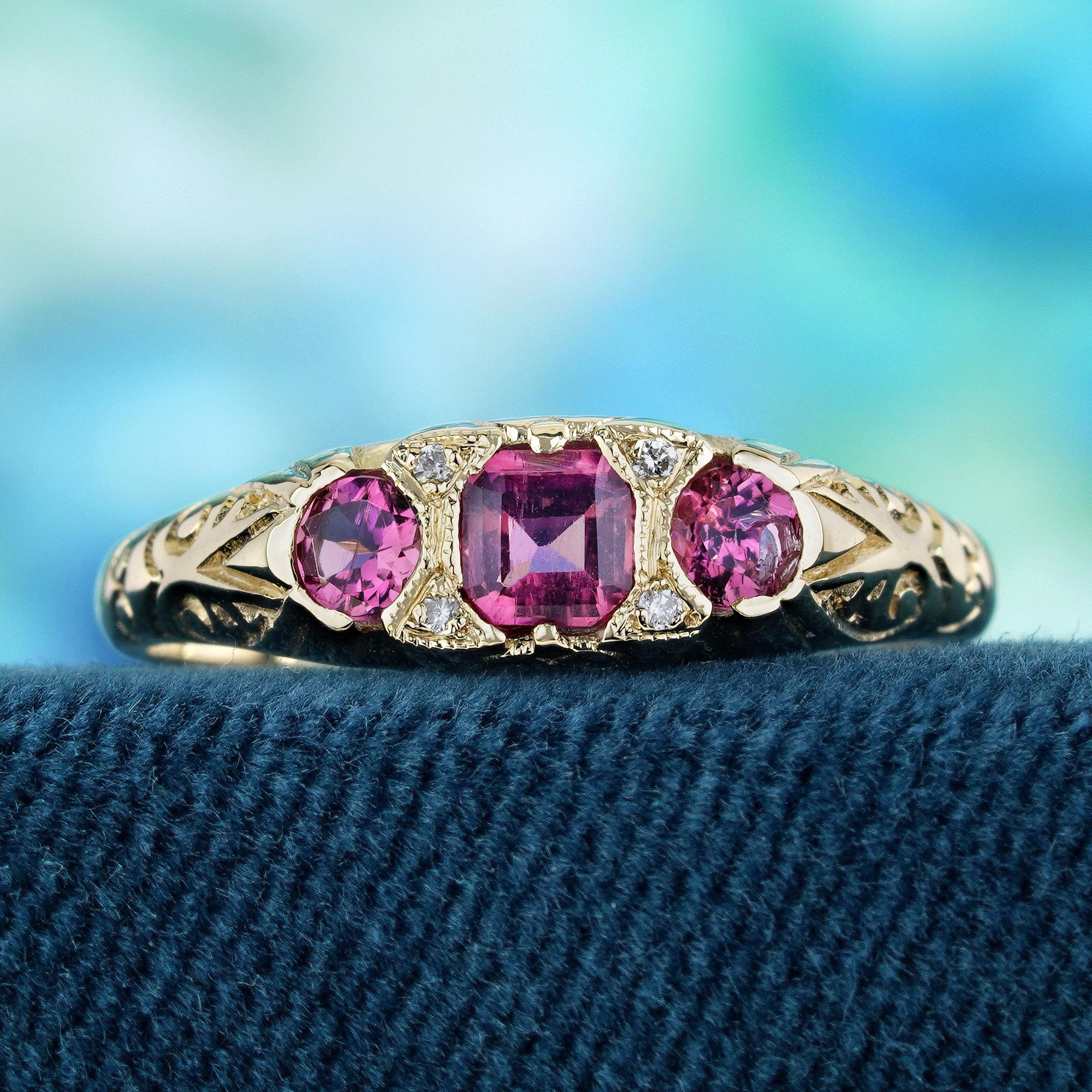 This ring emanates vintage charm with its intricate carved detailing and timeless aesthetic. The yellow gold setting offers a warm and rich backdrop for the gemstones. Positioned at the center are three natural vibrant pink tourmalines, their allure
