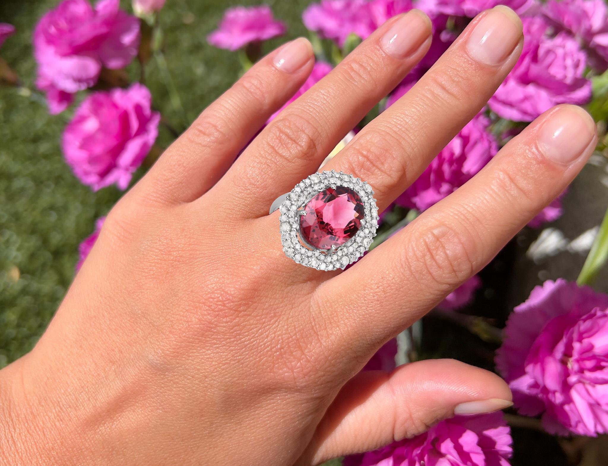 It comes with the appraisal by GIA GG/AJP
All Gemstones are Natural  
Pink Tourmaline = 7.85 Carat
74 Diamonds = 1.16 Carats
Metal: Black Rhodium Plated Sterling Silver 
Ring Size: 7.25* US
*It can be resized complimentary
