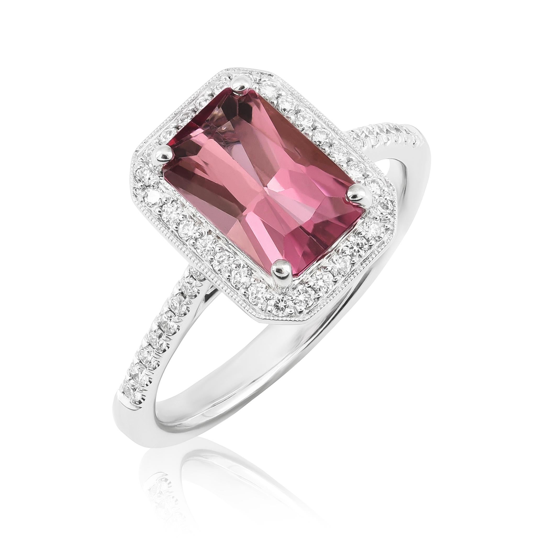 Discover the refined charm of this 14K white gold ring, featuring a vibrant natural pink tourmaline accented by sparkling diamonds. The soft pink hue of the emerald-cut tourmaline, paired with brilliant diamonds, makes this ring a sophisticated