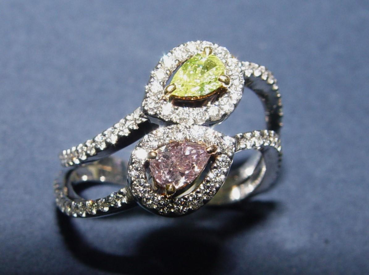 This elegant cocktail ring set with NATURAL fancy PINK pear shape cut diamond (well defined pink color diamond, measuring approximately 5.2x3.5x2.5mm deep, SI2 in clarity. We estimate 0.29CT). Second pear shape cut - NATURAL fancy Yellow diamond