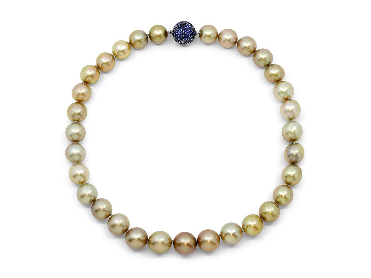 An exceptional necklace featuring 31 natural Pistachio South Sea pearls (12.05mm - 13.88mm) complemented by an 18K blackened gold 3.95-carat black gold sapphire pavé ball clasp. This certified untreated strand (GIA Report #14650986) showcases