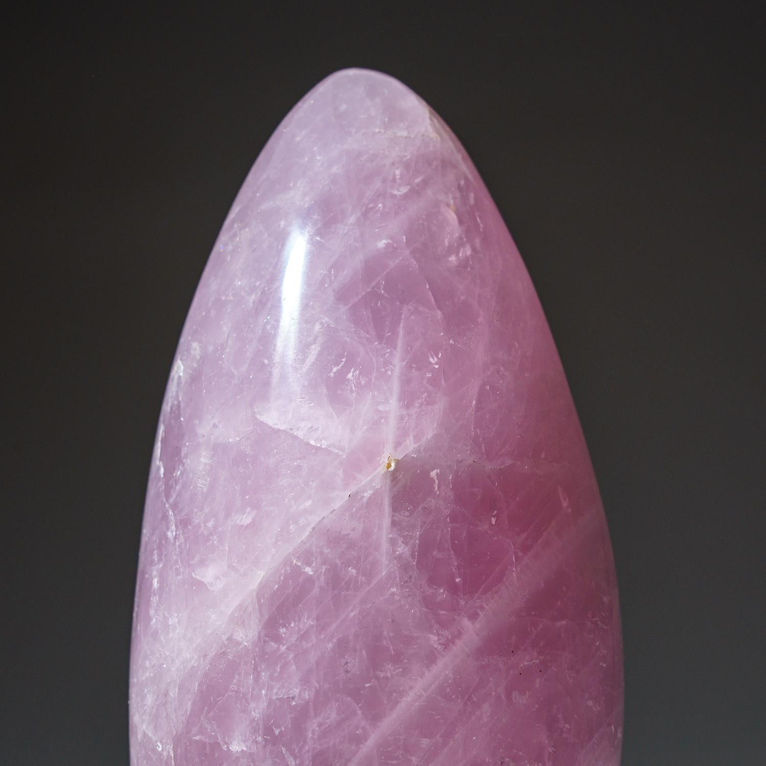 This museum quality, large freeform is carved from a solid piece of natural, gem quality Rose Quartz. This piece has remarkable transparency with a warm pink color. Hand polished to a mirrored finish.

Rose Quartz is the stone of unconditional