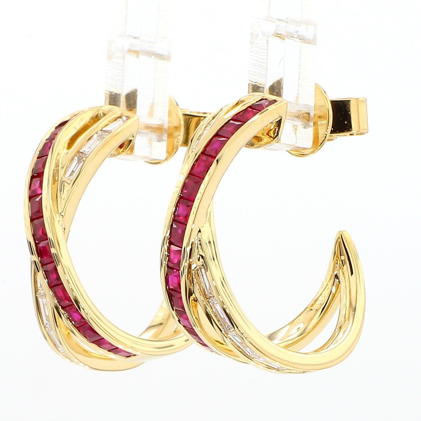 RareGemWorld's intriguing ruby earrings. Mounted in a beautiful 18K Yellow Gold setting with natural princess cut red ruby's complimented by natural white baguette cut diamonds. These earrings are guaranteed to impress and enhance your personal