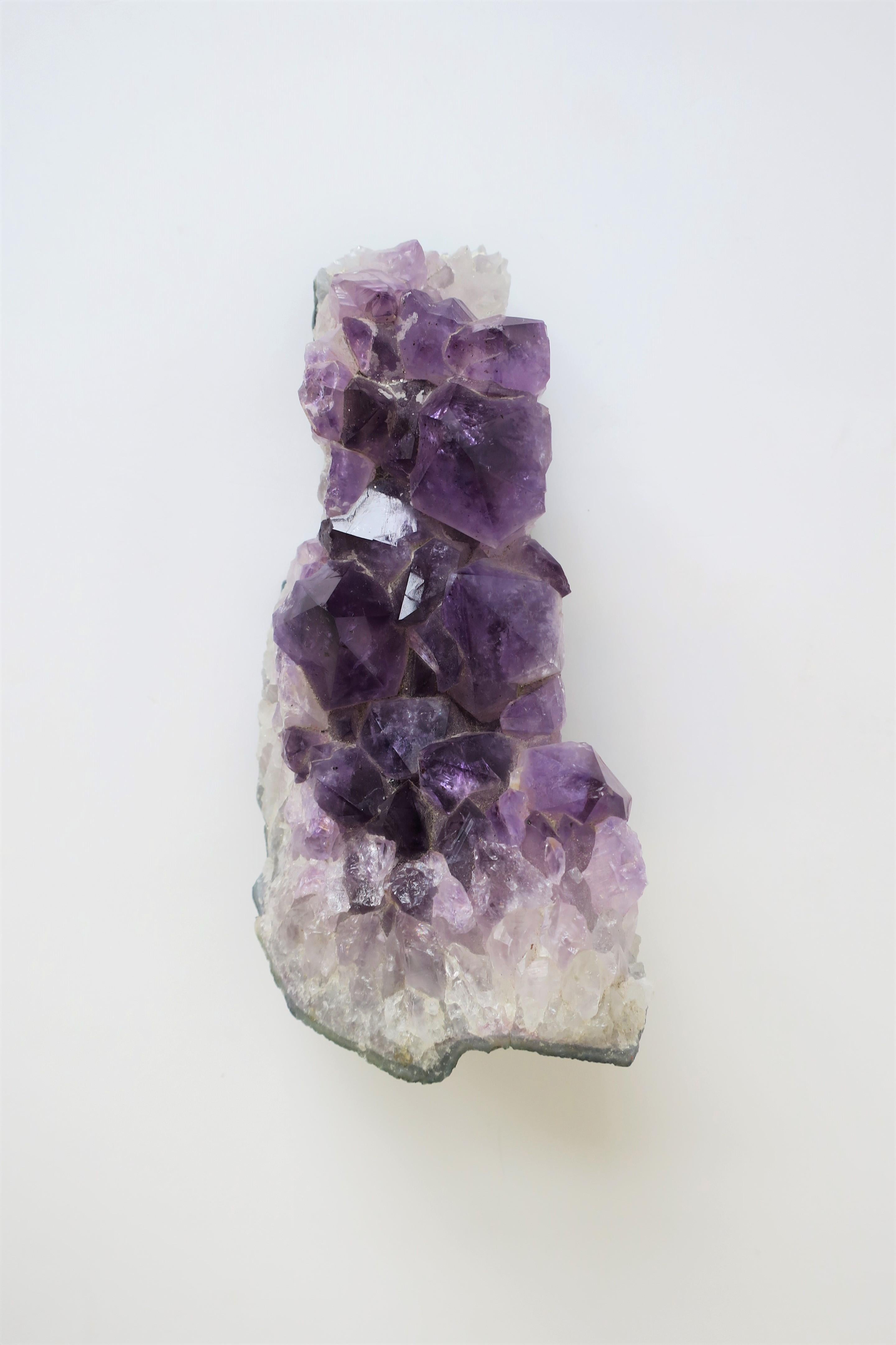 A beautiful and substantial fragment piece of natural purple amethyst. Piece makes a very beautiful decorative object as shown in images. Piece measures: 3.50