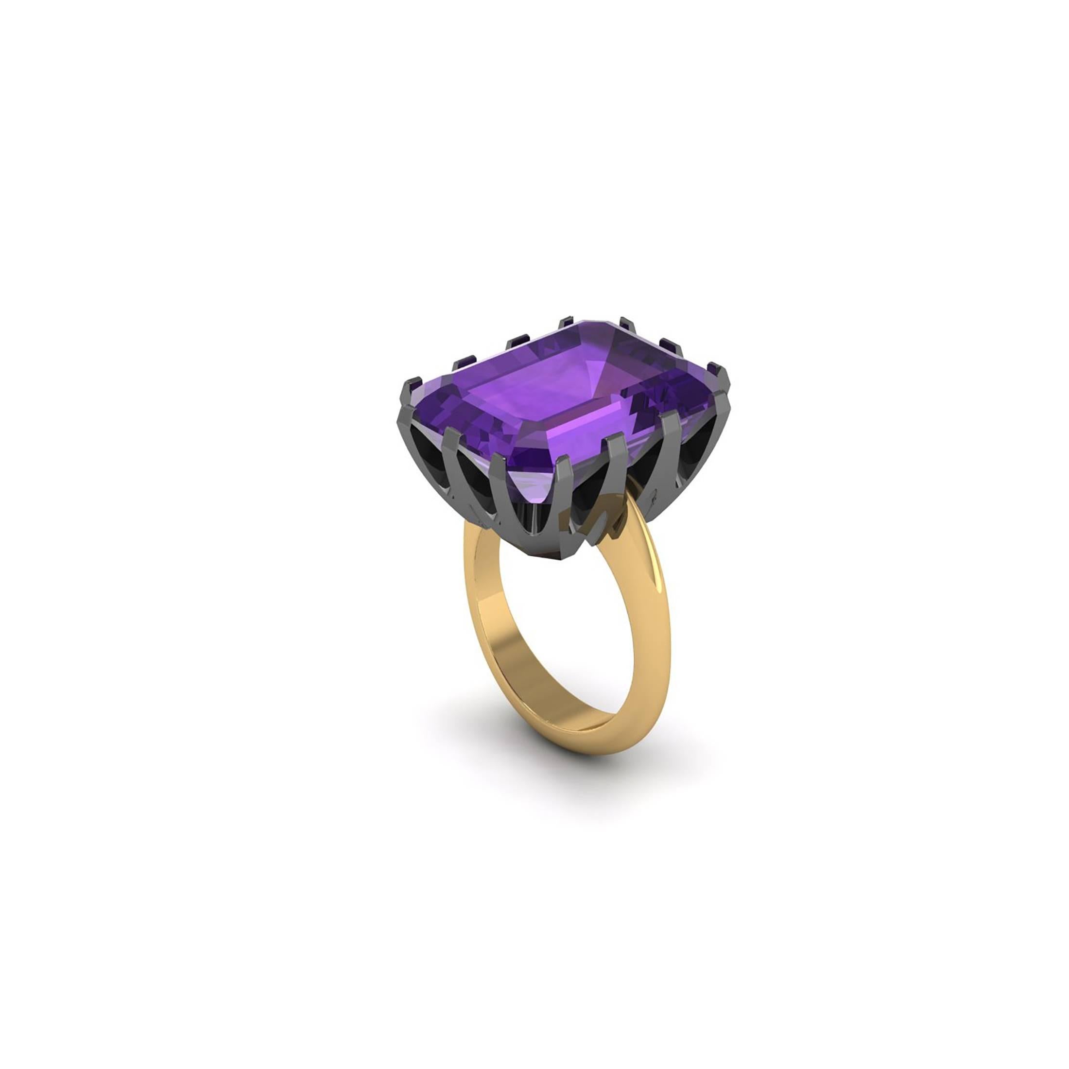 From Ferrucci a stunning natural Purple Amethyst, deep intense purple, emerald cut, totalling approximately 23carats,
accompanied by a hand made 18k black and 18k yellow gold, two tone ring, for a statement pieces.
A blend of modern design and