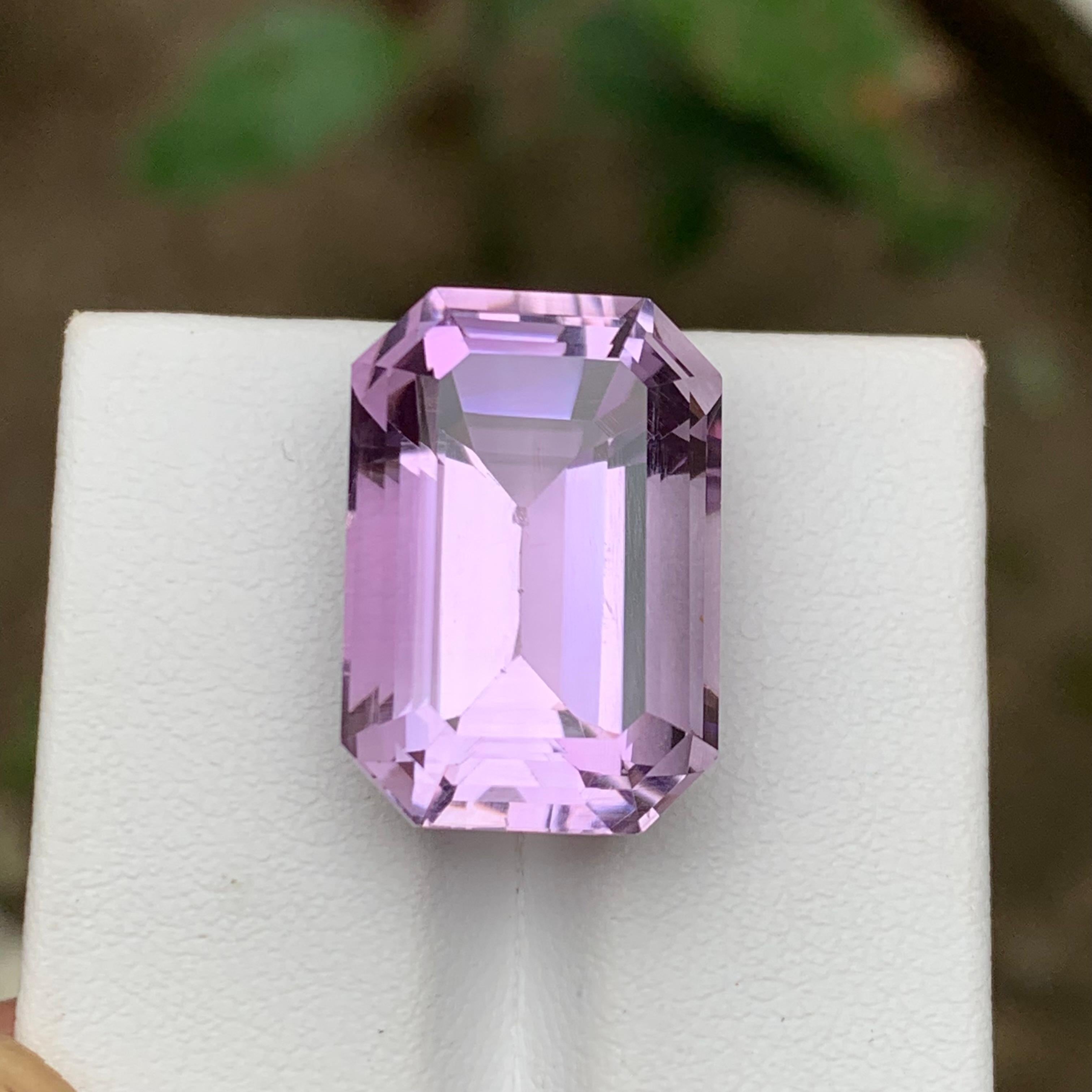 GEMSTONE TYPE: Amethyst 
PIECE(S): 1
WEIGHT: 22.05 Carats
SHAPE: Step Emerald Cut
SIZE (MM): 19.60 x 13.57 x 11.62
COLOR: Light Purple
CLARITY: Eye Clean
TREATMENT: None
ORIGIN: Africa
CERTIFICATE: On demand
(if you require a certificate, kindly