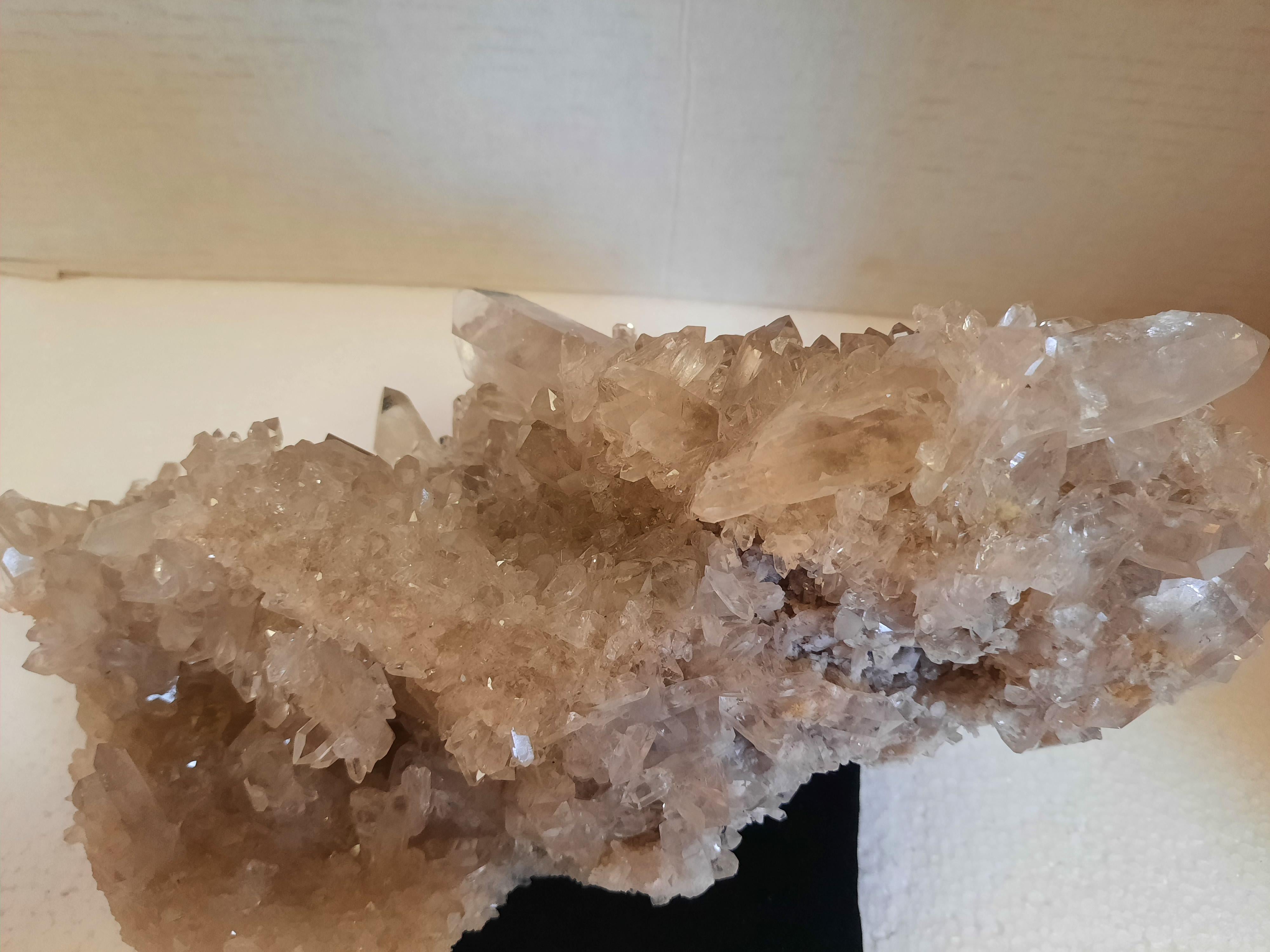 Beautiful natural quartz crystal specimen from Brazil. See photos for the details of the natural crystal formations that cover every side. This one-of-a-kind piece can accent a bookcase or even be used as a centerpiece to make a natural statement.