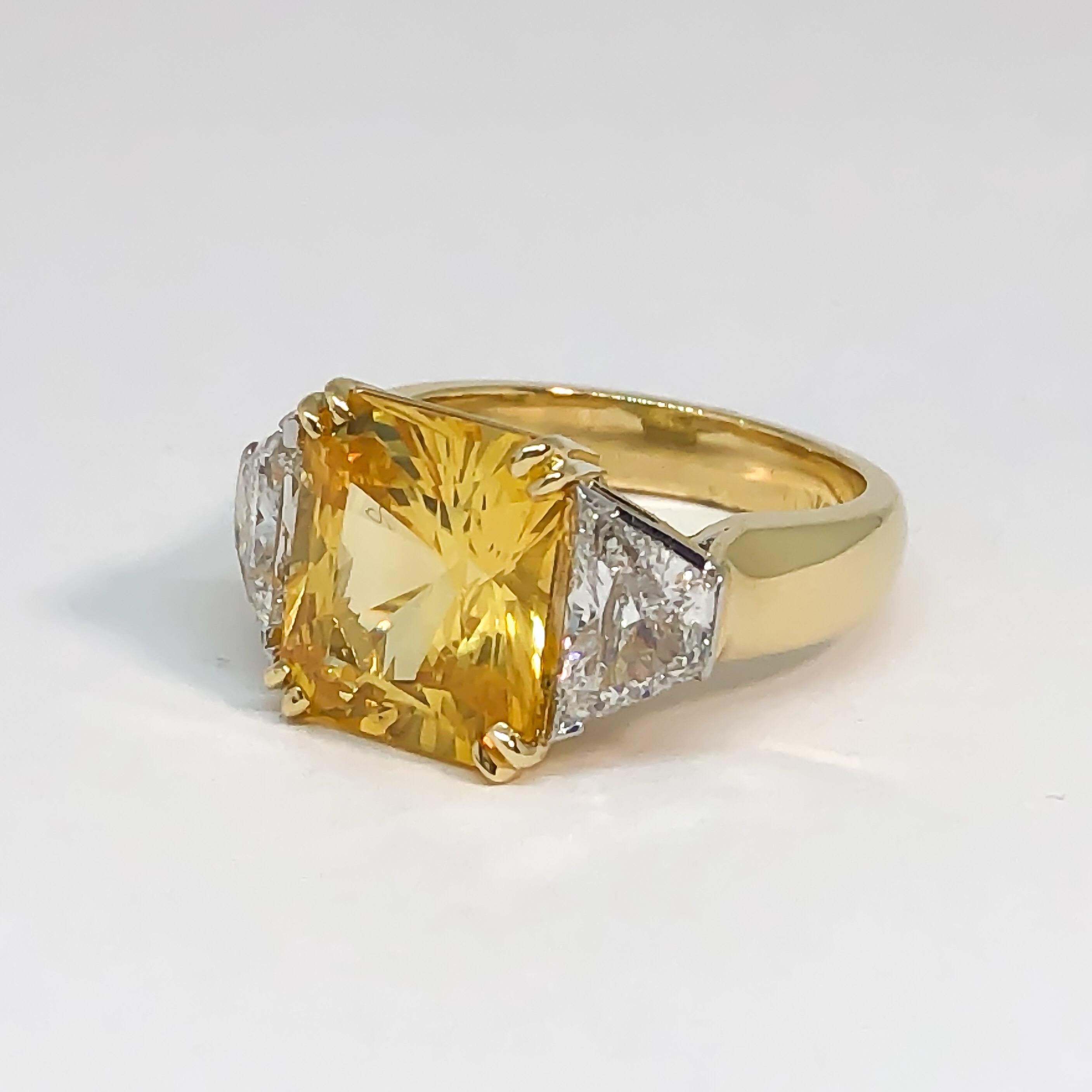 This is a gorgeous handmade custom natural yellow sapphire and diamond ring in 18K yellow gold and platinum. The center is a fancy radiant cut yellow sapphire measuring 12mm x 10.5mm x 7.5mm with a weight of 8.16 carats! The yellow sapphire is a