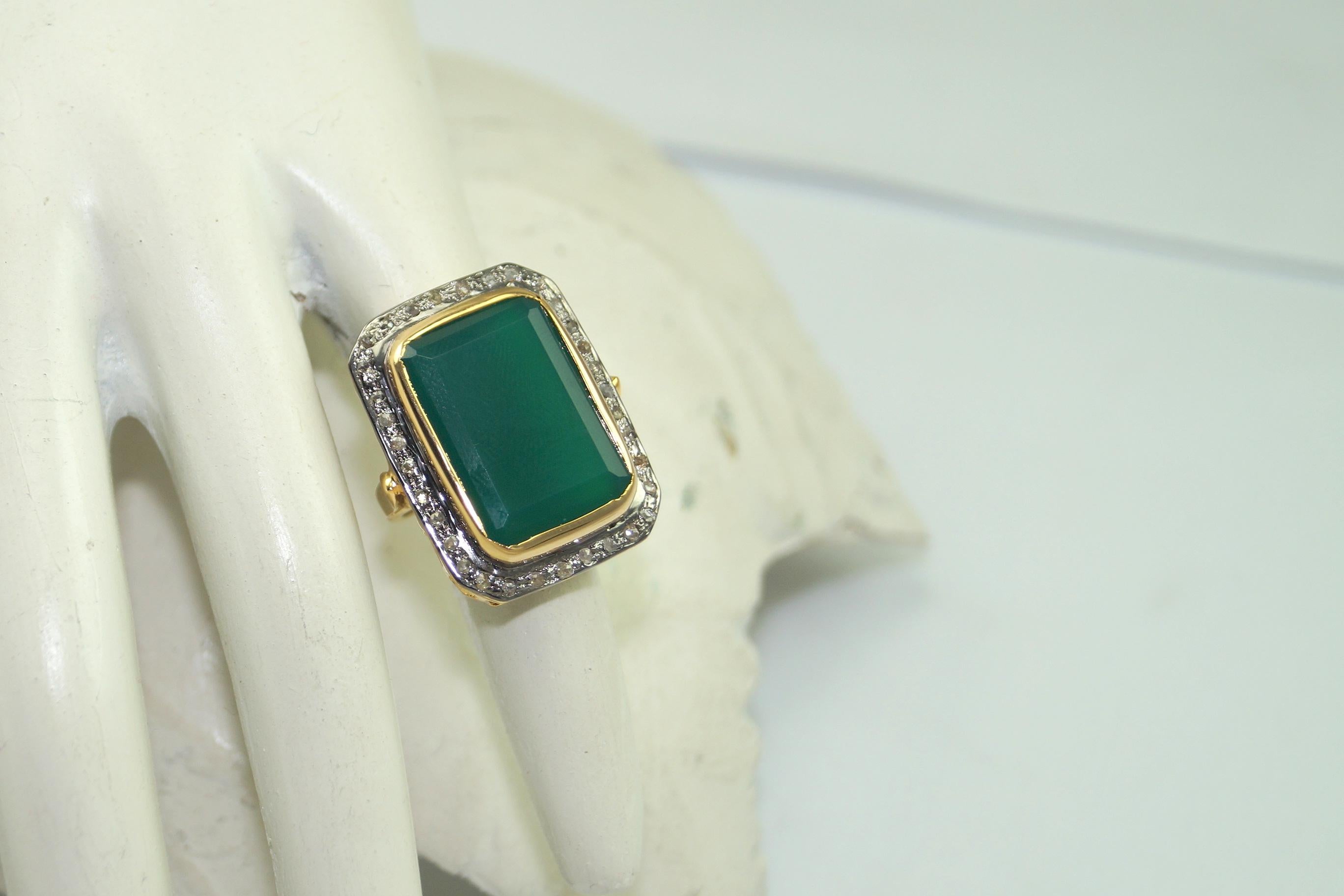 Stunning diamond sterling silver ring consists of :

Metal- Silver
Metal Purity- sterling silver
Color of metal- Yellow gold plating 
Diamond- Natural rose cut diamonds
Diamond origin- Natural earth mined
Diamond weight- 1.20cts
Gemstone- Emerald