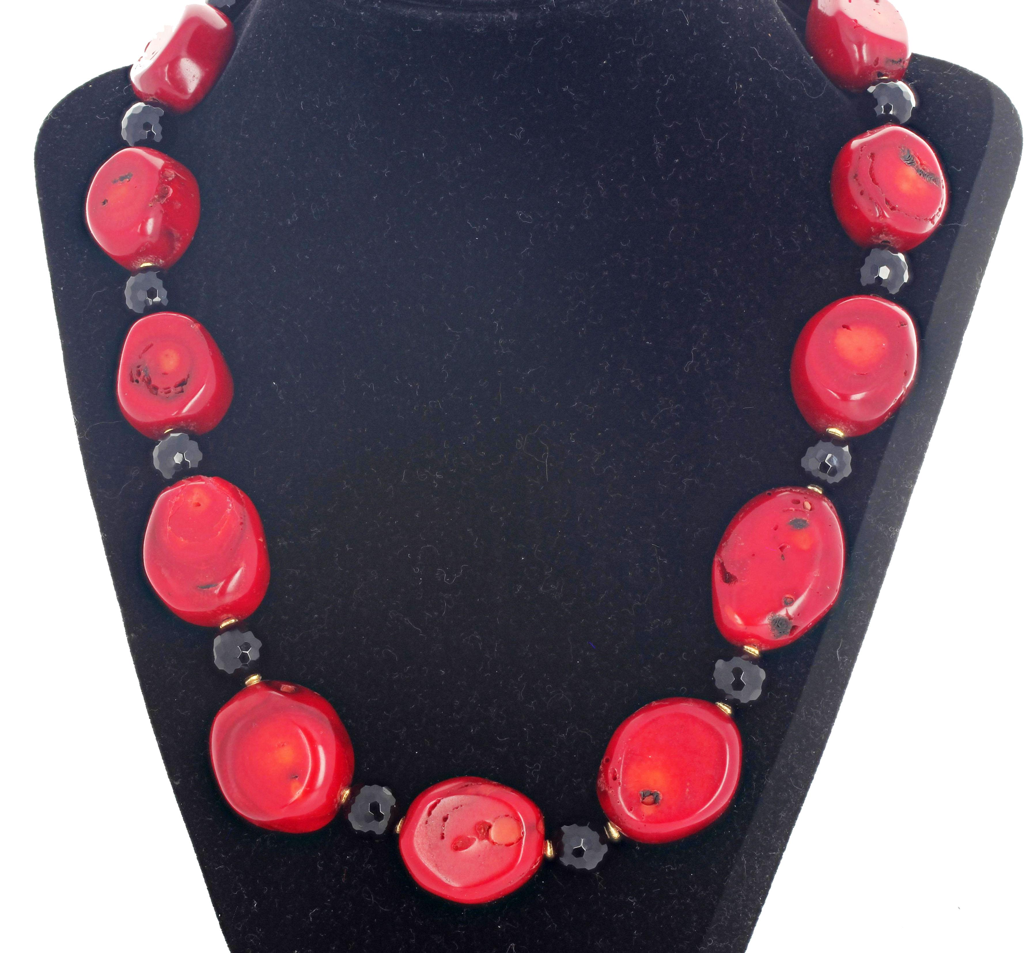 Beautiful natural red Coral - 28mm x 22 mm the largest - enhanced with sparkling checkerboard gem cut black Onyx and tiny gold plated rondels set in this 20 inch long elegant necklace.  