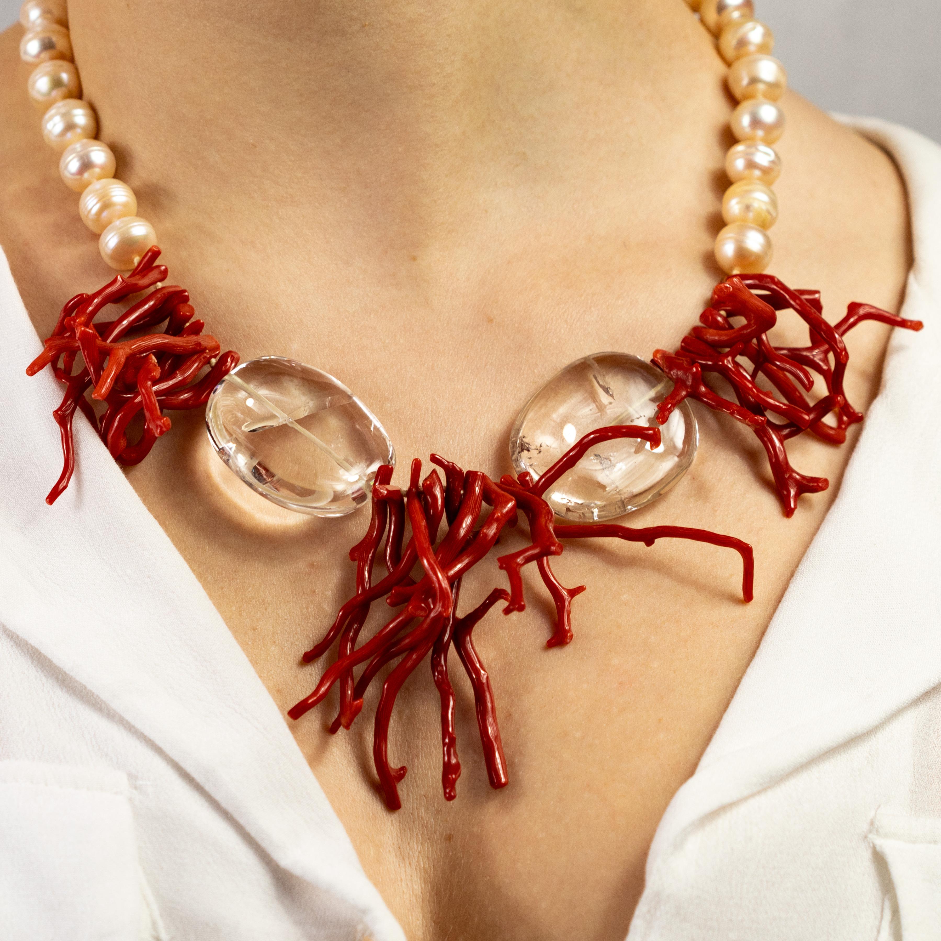 Immerse yourself in the beauty of this uniquely designed necklace with natural red coral, freshwater pearls and crystal rocks.
 
This design is inspired by the red corals of the Australian Great Barrier Reef. A subtle and harmonious jewel. The warm