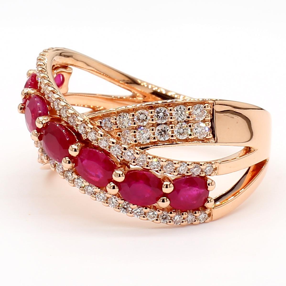RareGemWorld's classic ruby Cocktail Ring. Mounted in a beautiful 14K Rose Gold setting with a natural oval cut red ruby's complimented by natural round white diamond melee. This ring is guaranteed to impress and enhance your personal