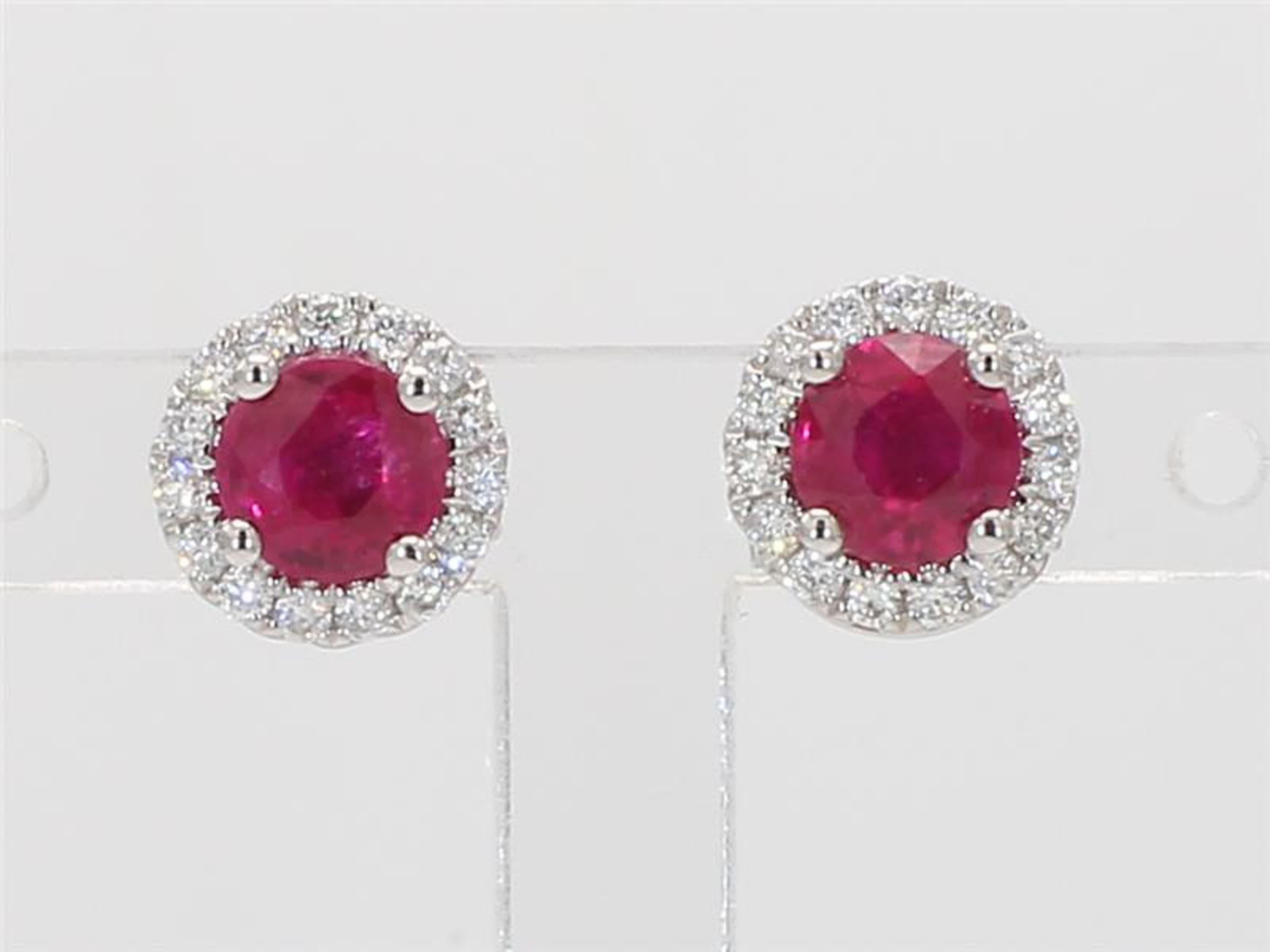 RareGemWorld's classic ruby earrings. Mounted in a beautiful 14K White Gold setting with natural round cut red ruby's. These ruby's are surrounded by a halo of natural round white diamond melee. These earrings are guaranteed to impress and enhance