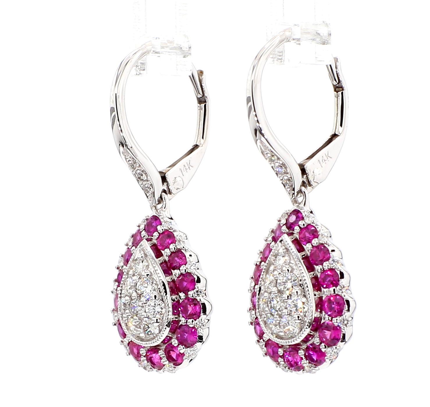 RareGemWorld's beautiful ruby earrings. Mounted in a beautiful 18K Rose and White Gold setting with natural round cut red ruby's complimented by natural round white diamond melee. These earrings are guaranteed to impress and enhance your personal