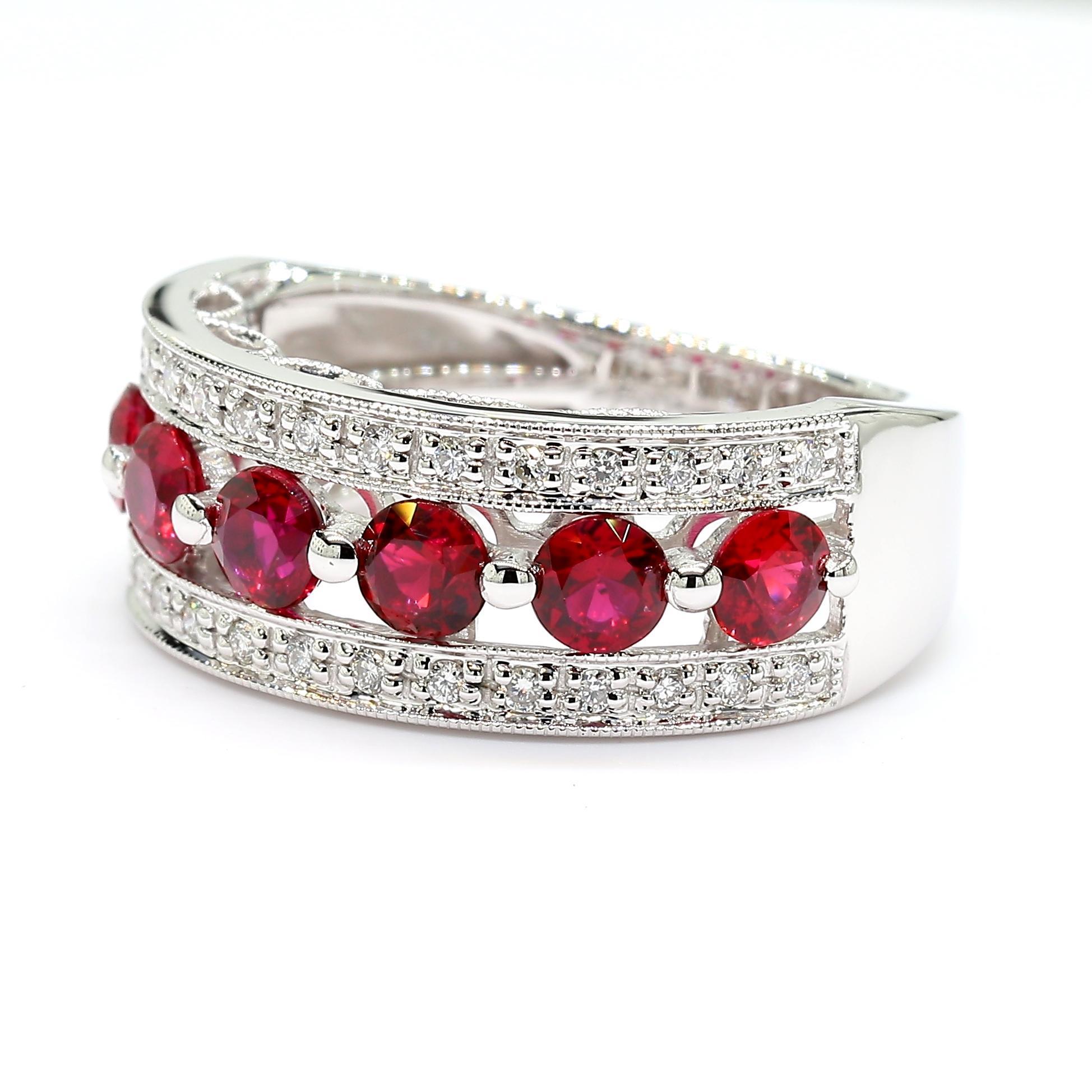 RareGemWorld's classic cocktail band. Mounted in a beautiful 18K White Gold setting with a natural round cut red ruby's complimented by natural round white diamond melee. This band is guaranteed to impress and enhance your personal