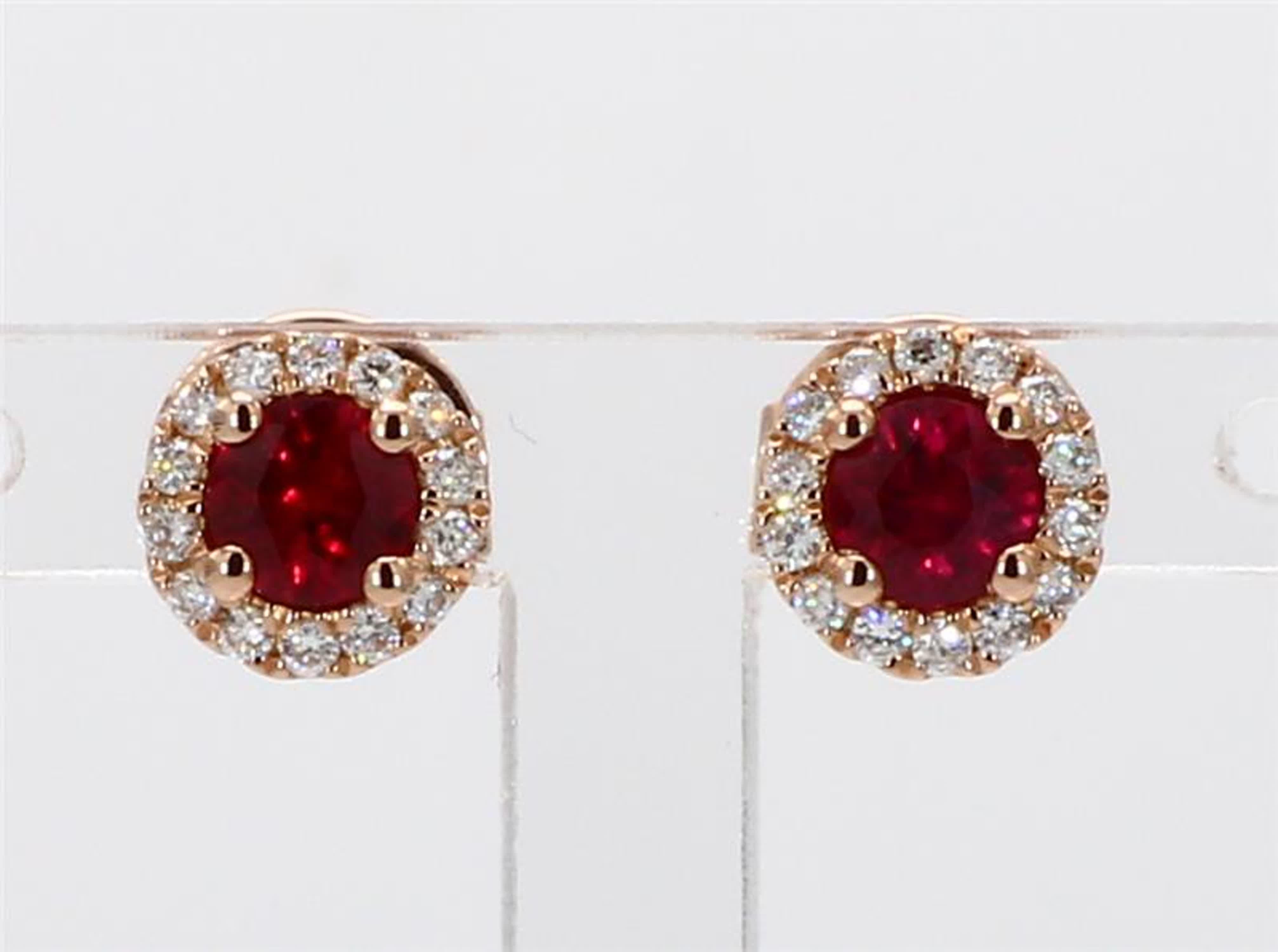 RareGemWorld's classic ruby earrings. Mounted in a beautiful 14K Rose Gold setting with natural round cut red ruby's. These ruby's are surrounded by a halo of natural round white diamond melee. These earrings are guaranteed to impress and enhance
