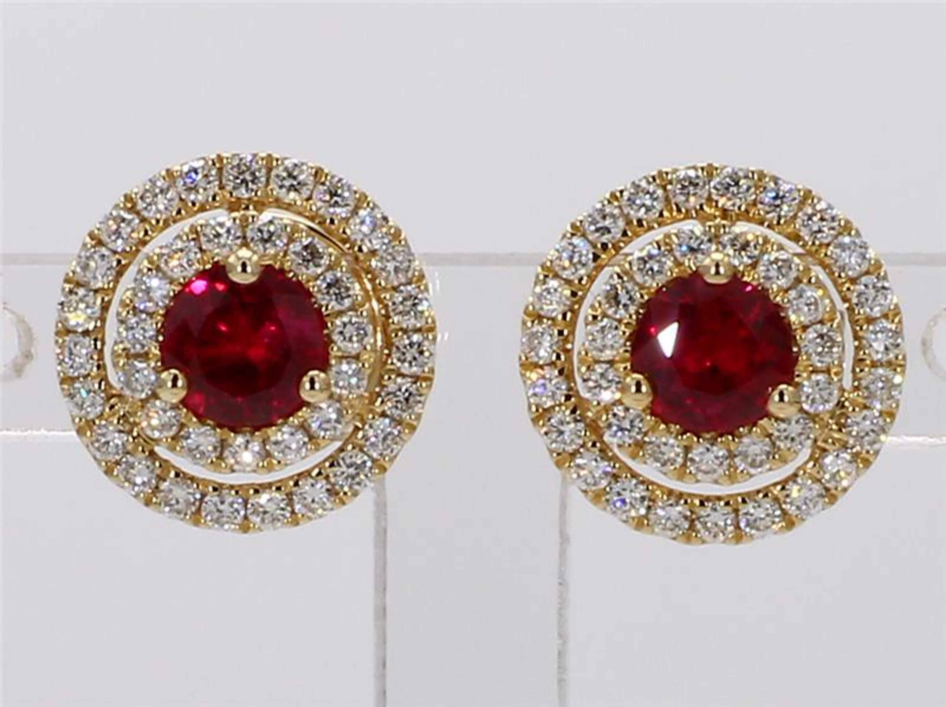 RareGemWorld's classic ruby earrings. Mounted in a beautiful 14K Yellow Gold setting with natural round cut red ruby's. These ruby's are surrounded by a double halo of natural round white diamond melee. These earrings are guaranteed to impress and