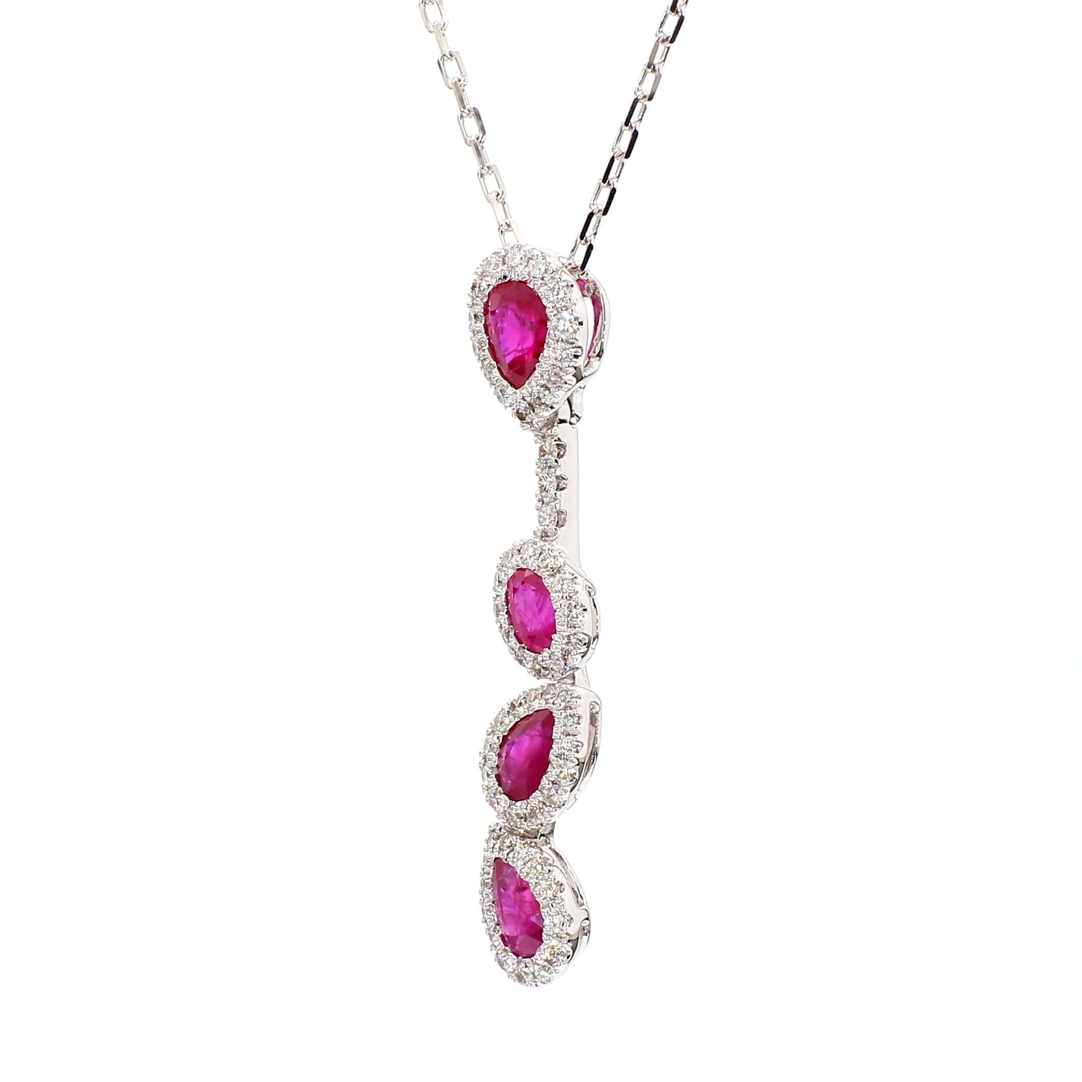 RareGemWorld's classic ruby pendant. Mounted in a beautiful 18K White Gold setting with a natural oval cut red ruby and natural pear cut red rubies. The ruby's are surrounded by natural round cut white diamond melee. This pendant is guaranteed to