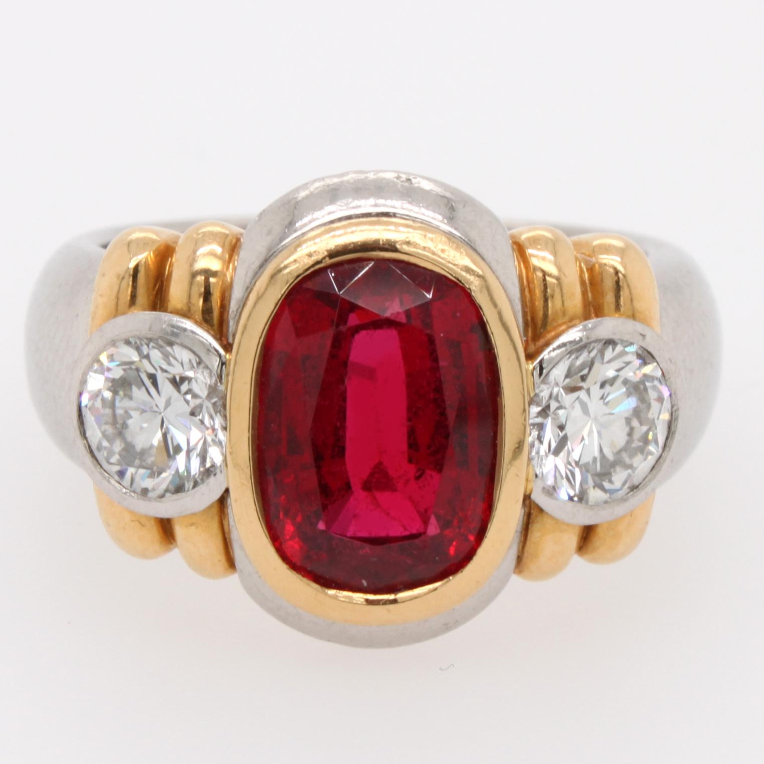 A very attractive modern spinel and diamond ring in platinum. The spinel has a fiery red colour and a beautiful crystal. It weighs approximately 3 carats and is a natural untreated, not heated, gemstone - accompanied by a gemological certificate. It