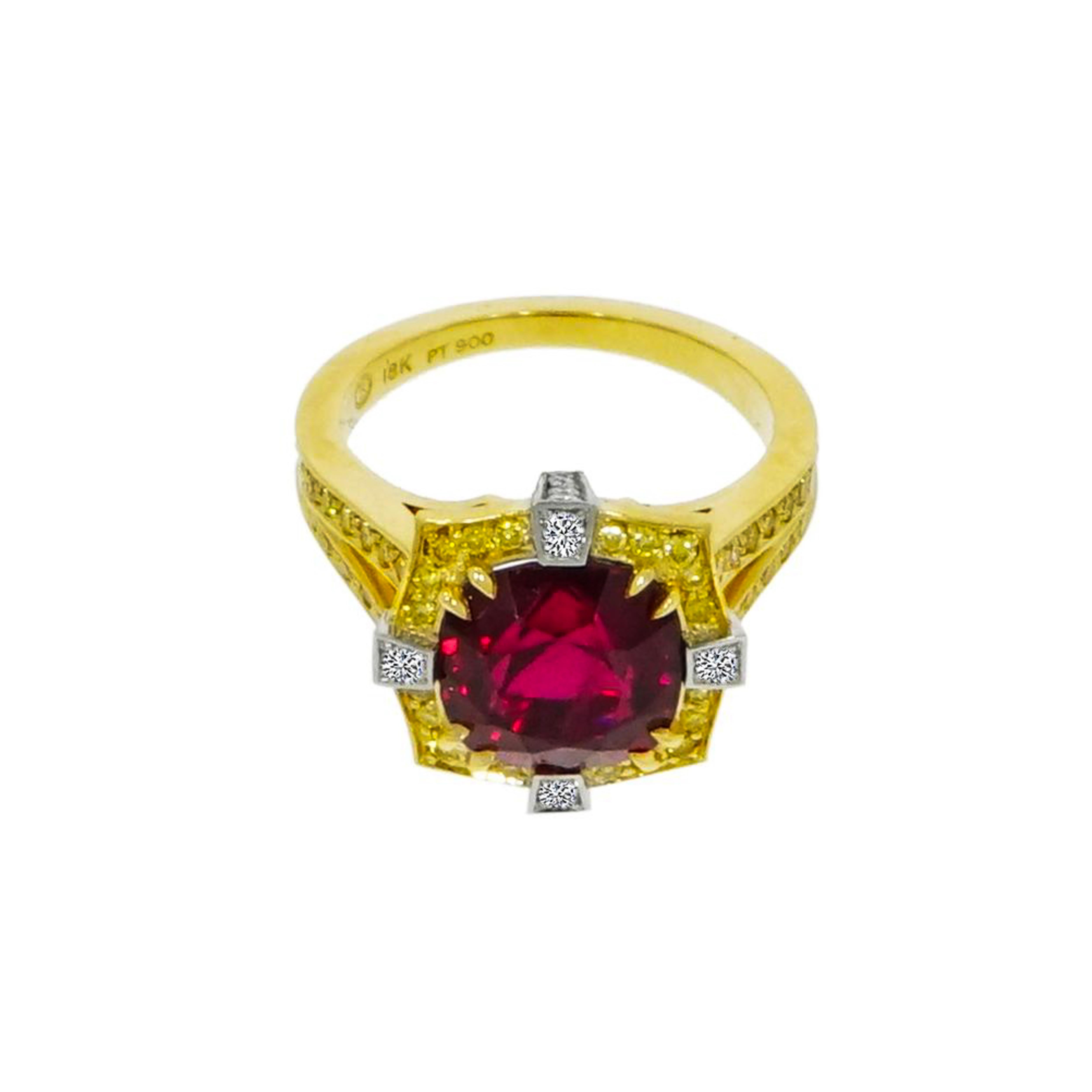 Rich in design and contrast, reflecting inspiration through this 4.35 carat Natural Red Spinel set in 18K Yellow Gold with Vivid Fancy Intense Yellow Diamond Halo and accented by 4 white round Diamonds at each corner set in Platinum. 
The Natural