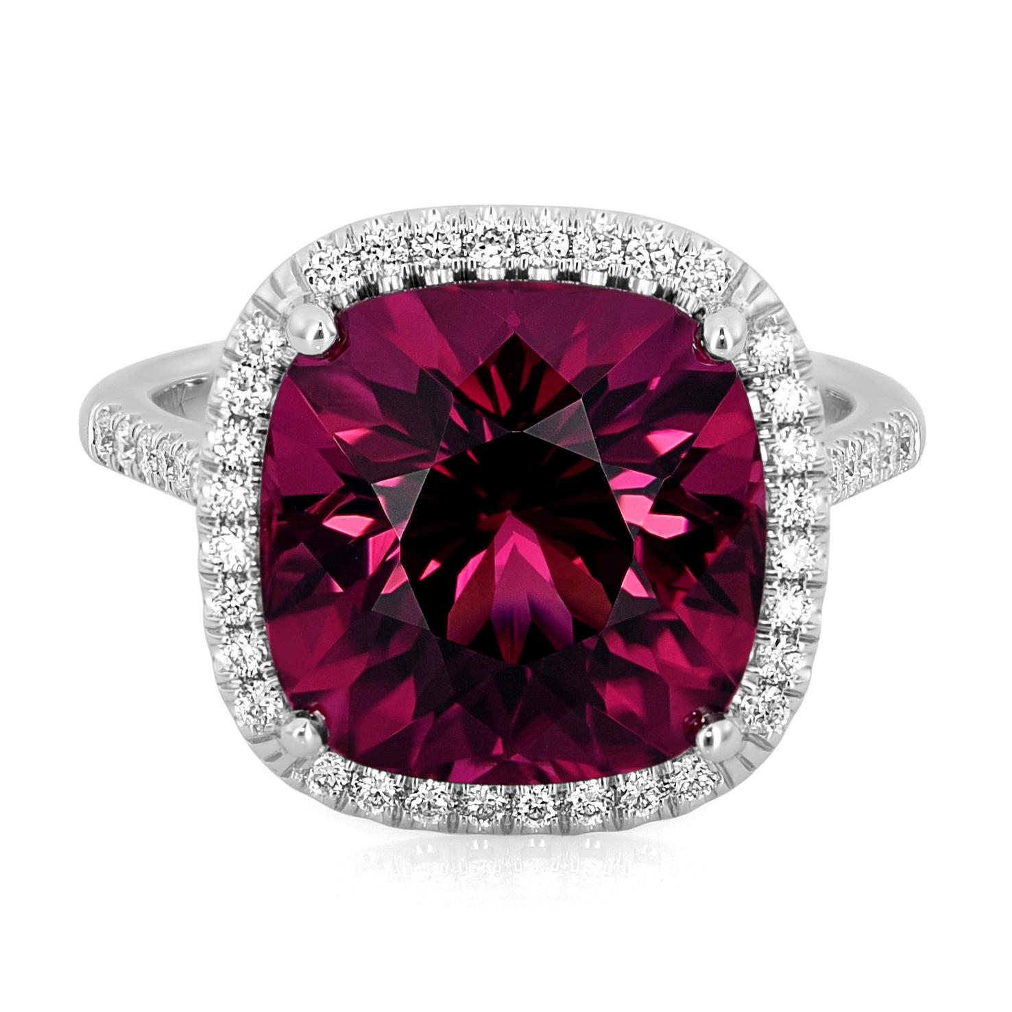 Discover the enchanting elegance of this natural red tourmaline ring, beautifully set in 14K white gold. This exquisite piece, accented by sparkling diamonds, showcases superior craftsmanship and the stunning beauty of these precious gemstones.