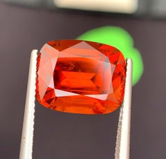 Natural Reddish Orange Grossular Garnet Gemstone: 10.80 Carat Cushion Cut