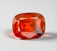 Natural Reddish Orange Grossular Garnet Gemstone: 5.05 Carat Cushion Cut