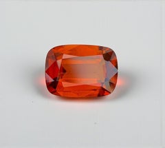 Natural Reddish Orange Grossular Garnet Gemstone: 6.26 Carat Cushion Cut