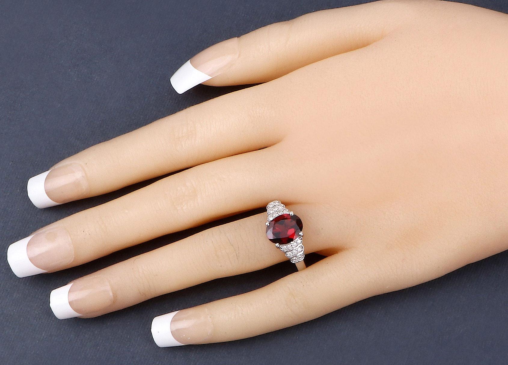 It comes with the appraisal by GIA GG/AJP
Rhodolite Garnet = 2.75 Carat ( 10 x 8 mm )
Cut: Oval
Diamonds = 0.15 Carats
Diamonds Quantity: 18
Metal: 14K White Gold
Ring Size: 7* US
*It can be resized complimentary