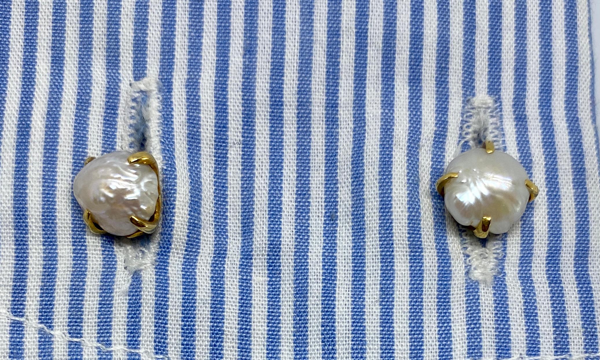 A pair of antique cufflinks in yellow gold by Tiffany & Co featuring four natural river pearls.

Natural river pearls are extremely rare and highly sought-after by pearl connoisseurs and collectors. These cufflinks feature four, ranging in size from