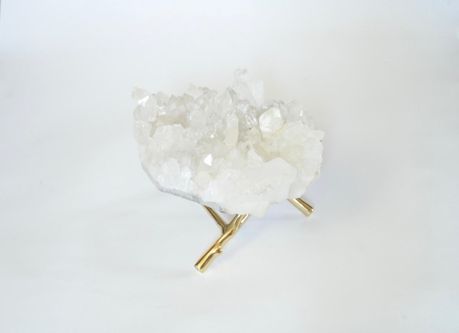 A natural rock crystal cluster with polish brass stand.
Measures: I 12” /L x 8” /D x 4” /H without stand.