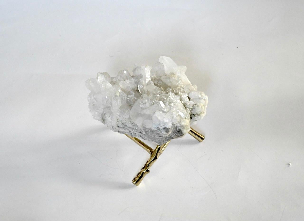 Natural rock crystal sculpture with stand. Billion year old natural quartz sculpture, with various sized crystals growing from the surface. Measures: 9”/ L x 8”/ D x 4”/ H without stand.