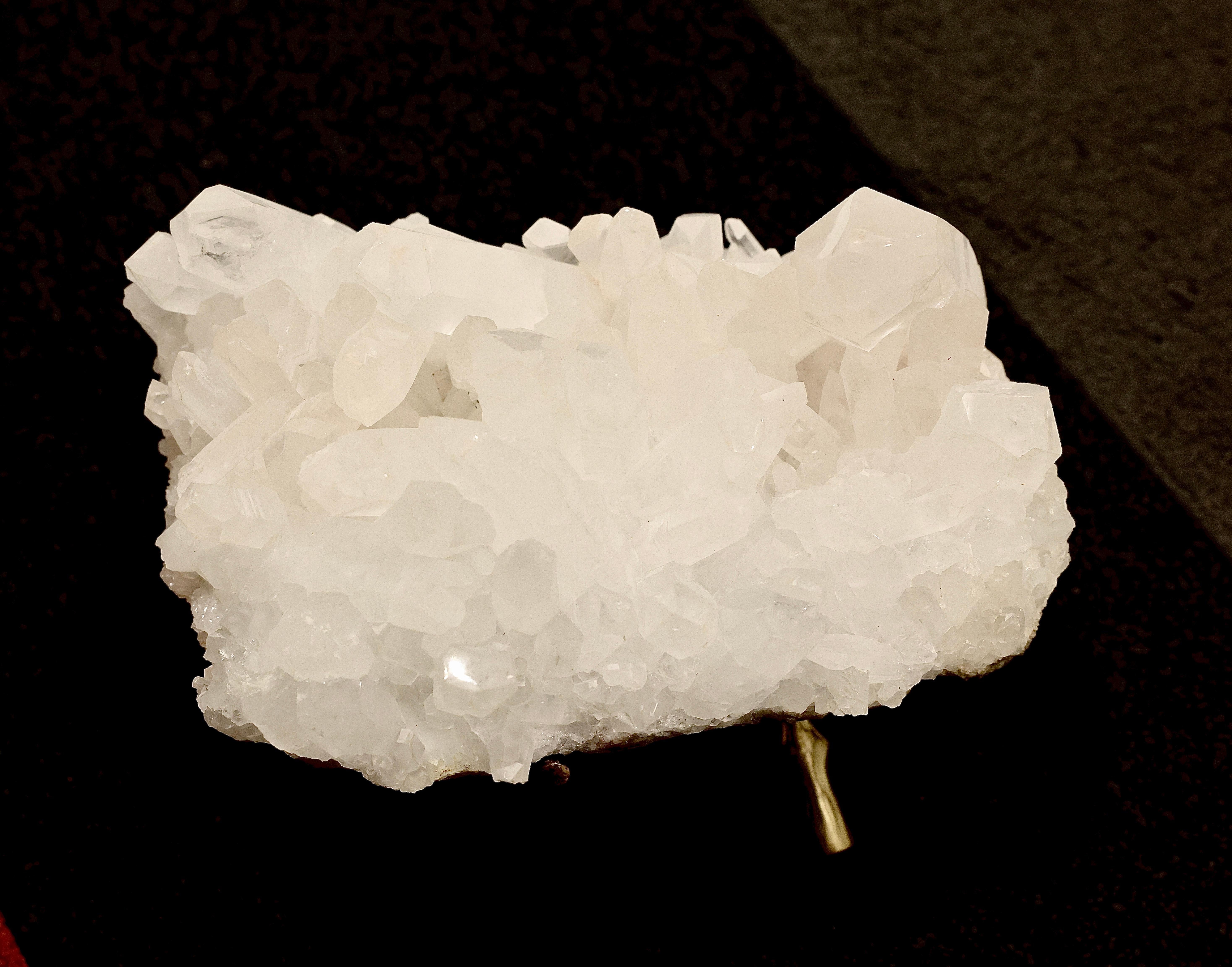 Natural rock crystal sculpture on stand 
Measures: 13”/L x 9”/D x 5”/H without stand.