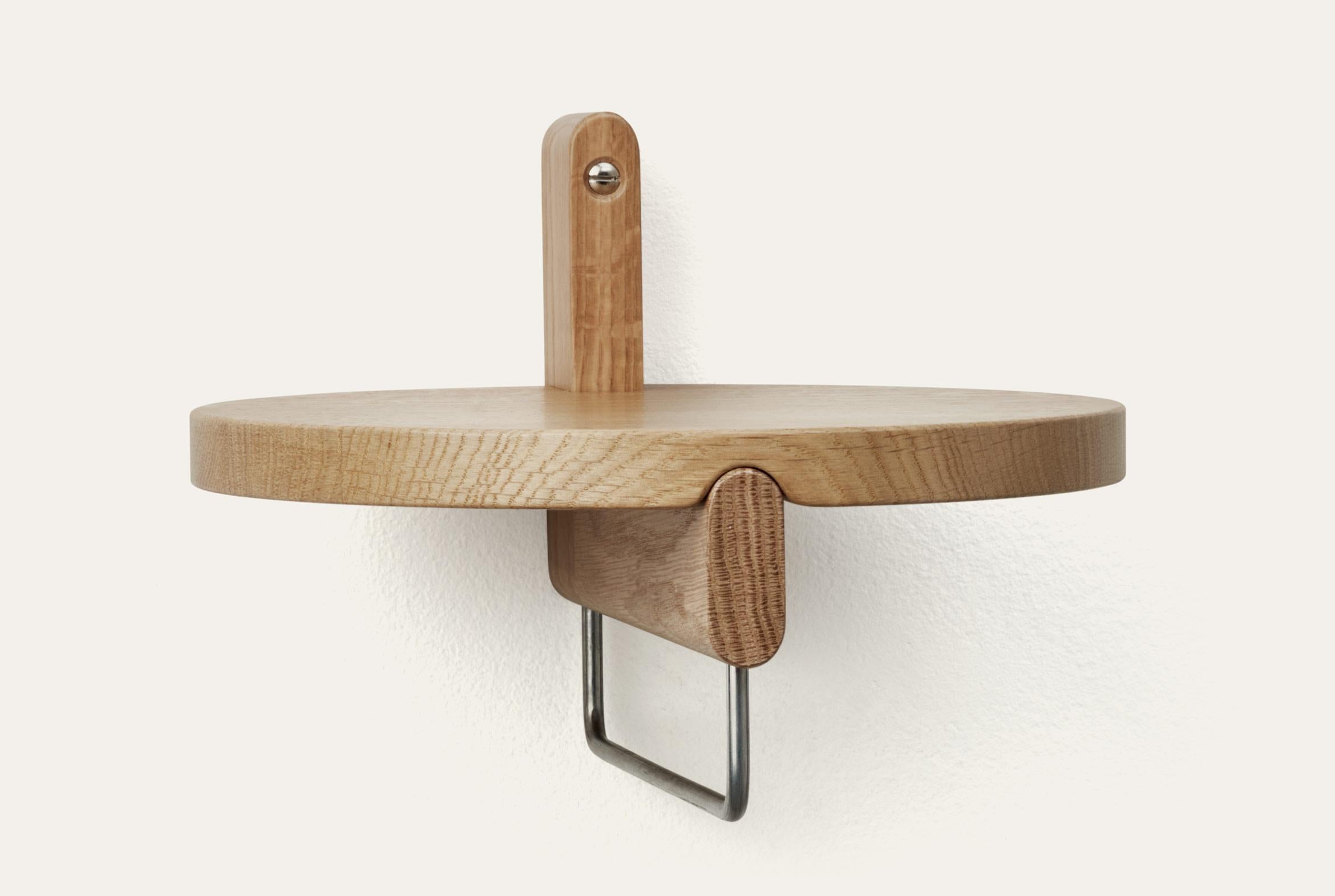Natural Rondelle round shelf with hanger by Storängen Design
Dimensions: D 25 x H 18 cm
Materials: oak wood, steel.
Available in other colors and with or without steel hanger.

Rondelle can be a shelf or a small table depending on your needs.