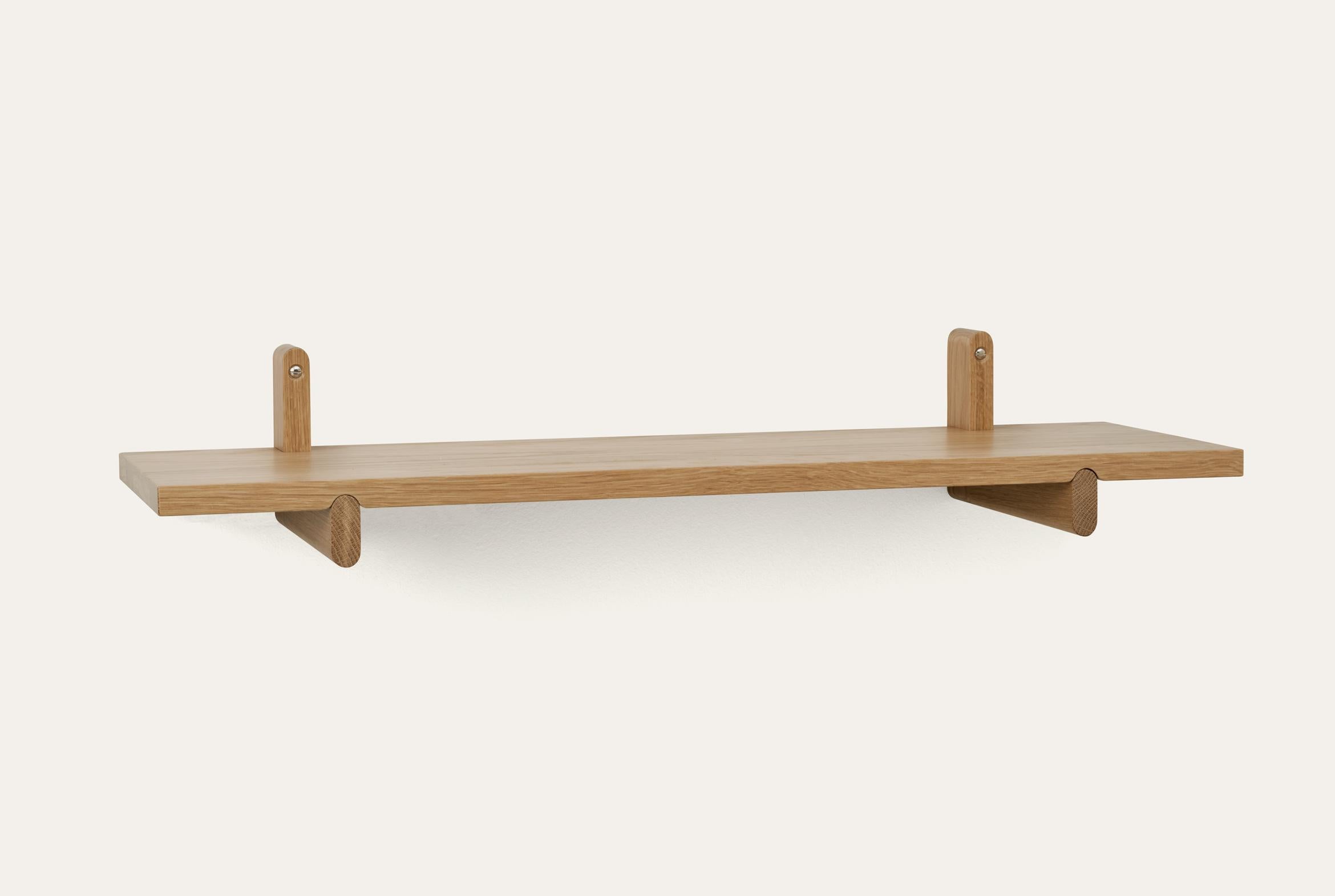 Natural Rondelle shelf by Storängen Design
Dimensions: D 80 x W 25 x H 18 cm
Materials: oak wood.
Available in other colors and with or without steel hanger.

Rondelle can be a shelf or a small table depending on your needs. It shares the same