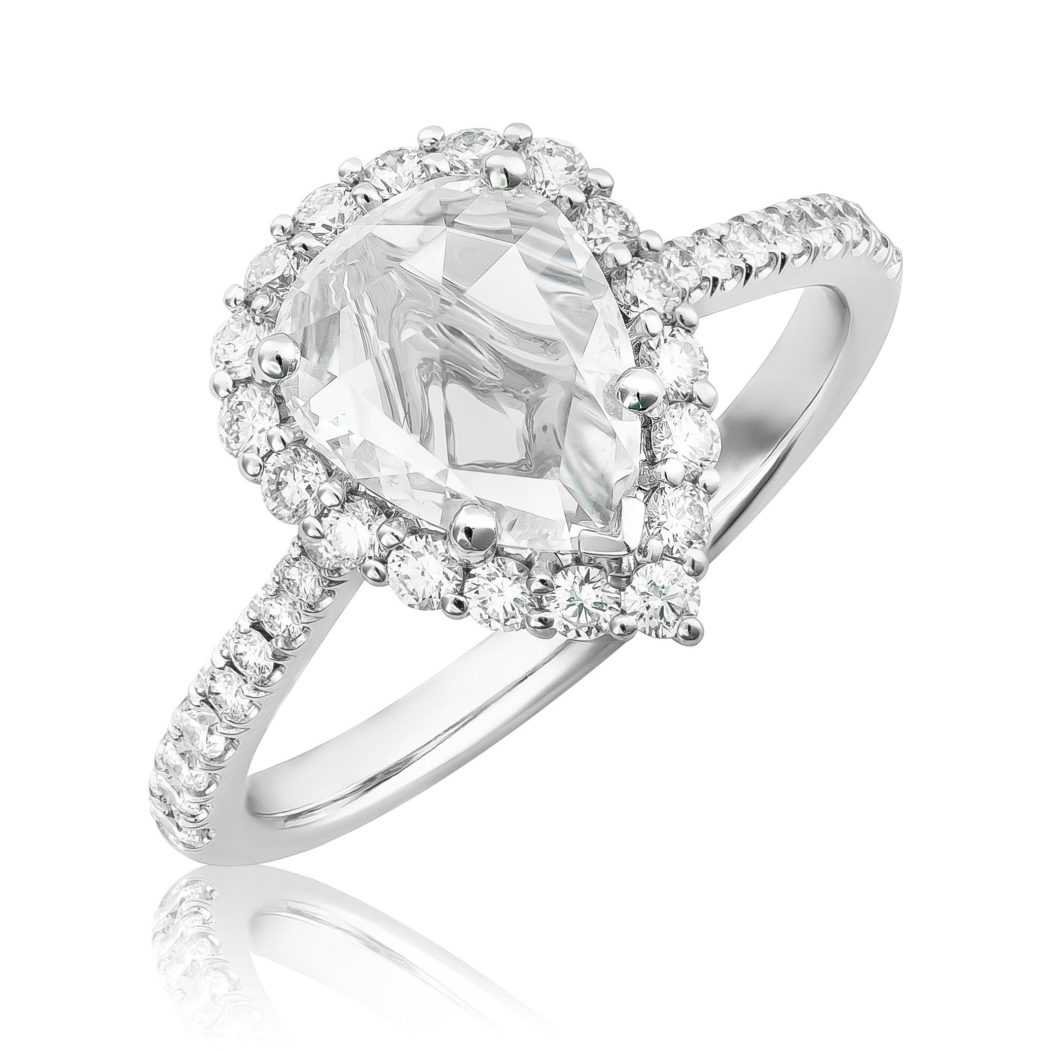 Discover the vintage-inspired elegance of this 14K white gold ring, featuring a stunning 1.00-carat rose-cut diamond accented by brilliant diamonds. The pear-shaped center stone, with its antique-style rose cut, exudes timeless charm, while the