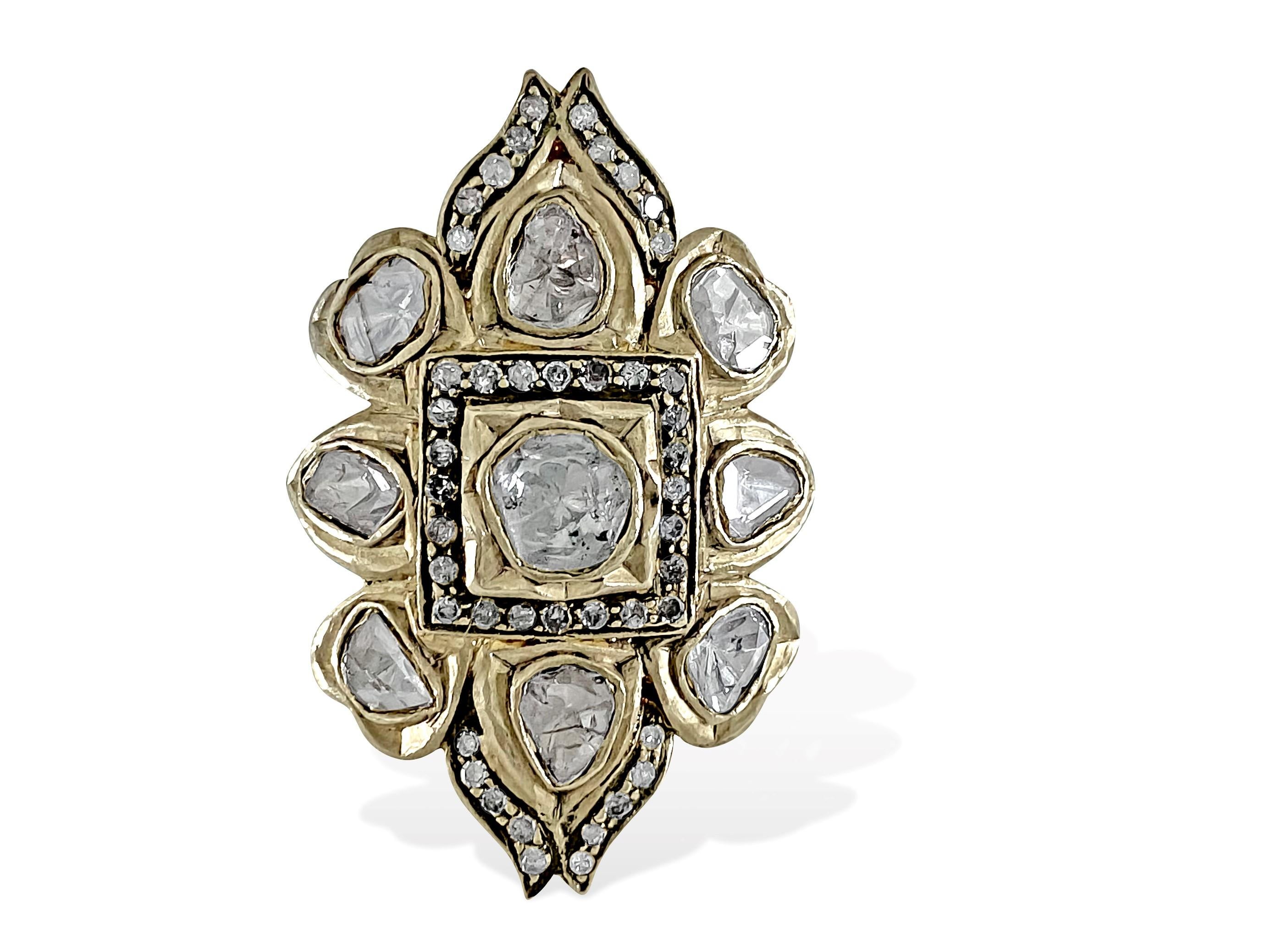 This unique ring features a natural rose-cut diamond pave set in sterling silver and complemented by 14K yellow gold accents. With a gross weight of 10.40 grams, including 4.60 grams of 14K yellow gold and 5.45 grams of 925 sterling silver, it
