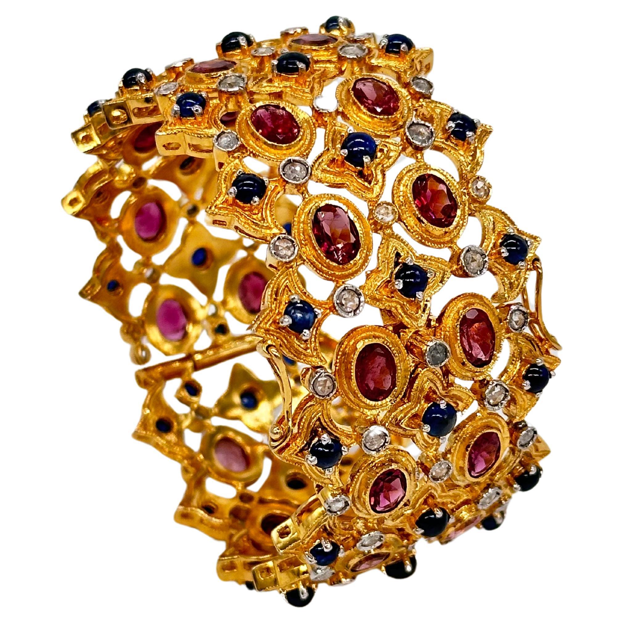 SKU-PUJ-145/VE
Add a touch of luxury to your jewelry collection with this magnificent broad 18K gold-plated hinged bangle bracelet. Crafted from sterling silver, this stunning piece is adorned with natural ruby (glass-filled) and blue sapphire