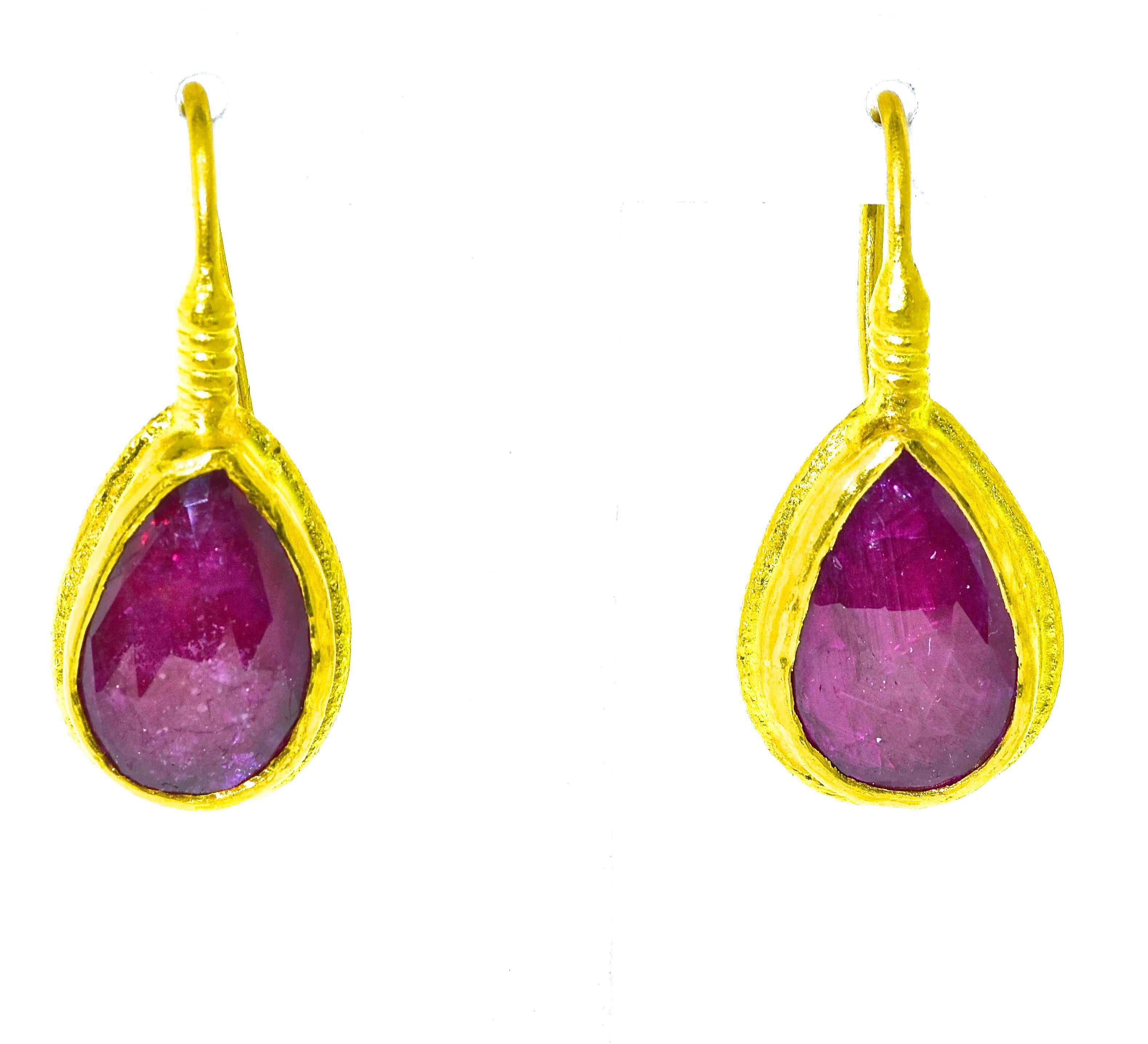 Natural rubies weighing approximately 3.0 cts, set in 23K gold.  These earrings weigh 3 dwt., are 1 inch in length and signed on the back by ARA and 985 which is for the gold karat.  Contemporary and new these earrings are easy to wear, they have a