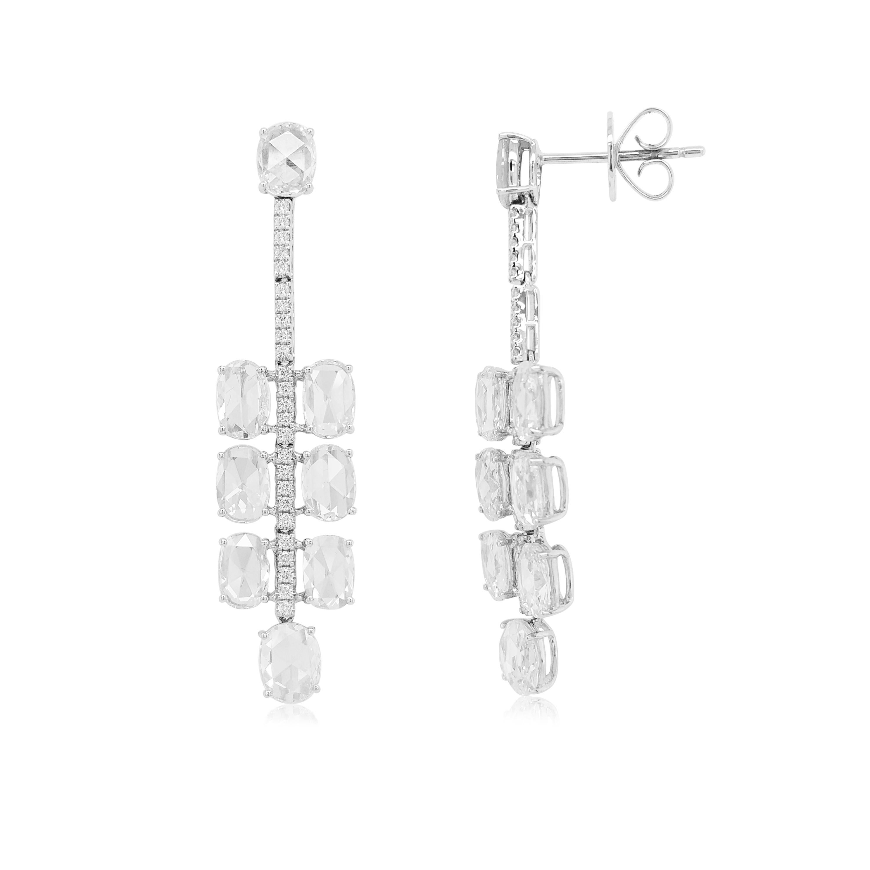 These elegant earrings feature lustrous scintillating Rose Cut White Diamonds, with a line of brilliant diamonds. Set in 18K white gold, these earrings are designed to move with their wearer, meaning that they will exude a constant sparkle. Pair