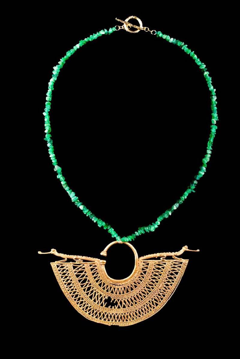 Contemporary Emerald natural chip necklace with an antique large lost wax cast gold ear ornament Ca. 800 to 1400 CE with caymans along the top edge. Cast with three rows of openwork triangular and diamond patterns and four borders of false filigree.