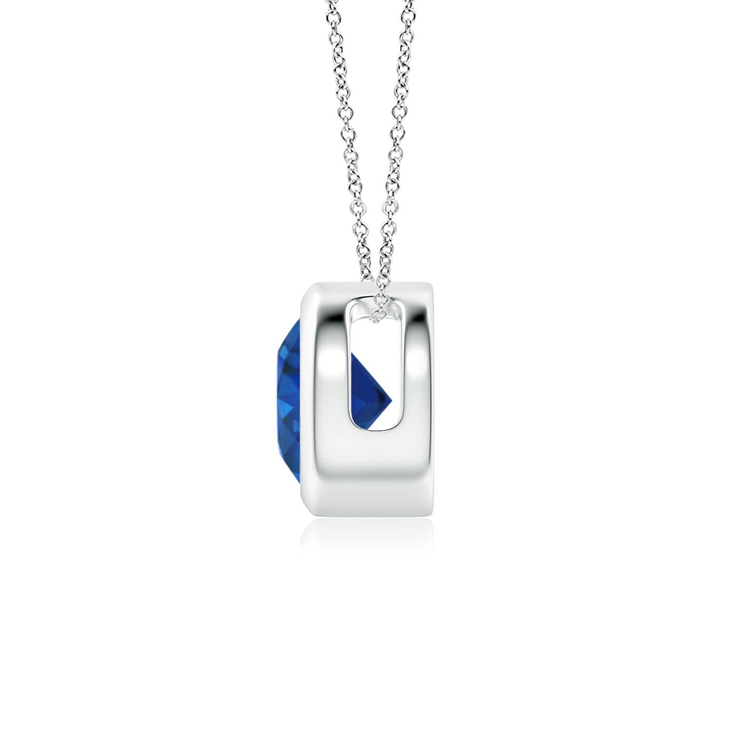 This classic solitaire sapphire pendant's beautiful design makes the center stone appear like it's floating on the chain. The radiant blue gem is secured in a bezel setting. Crafted in 14k white gold, this round sapphire pendant is simple yet