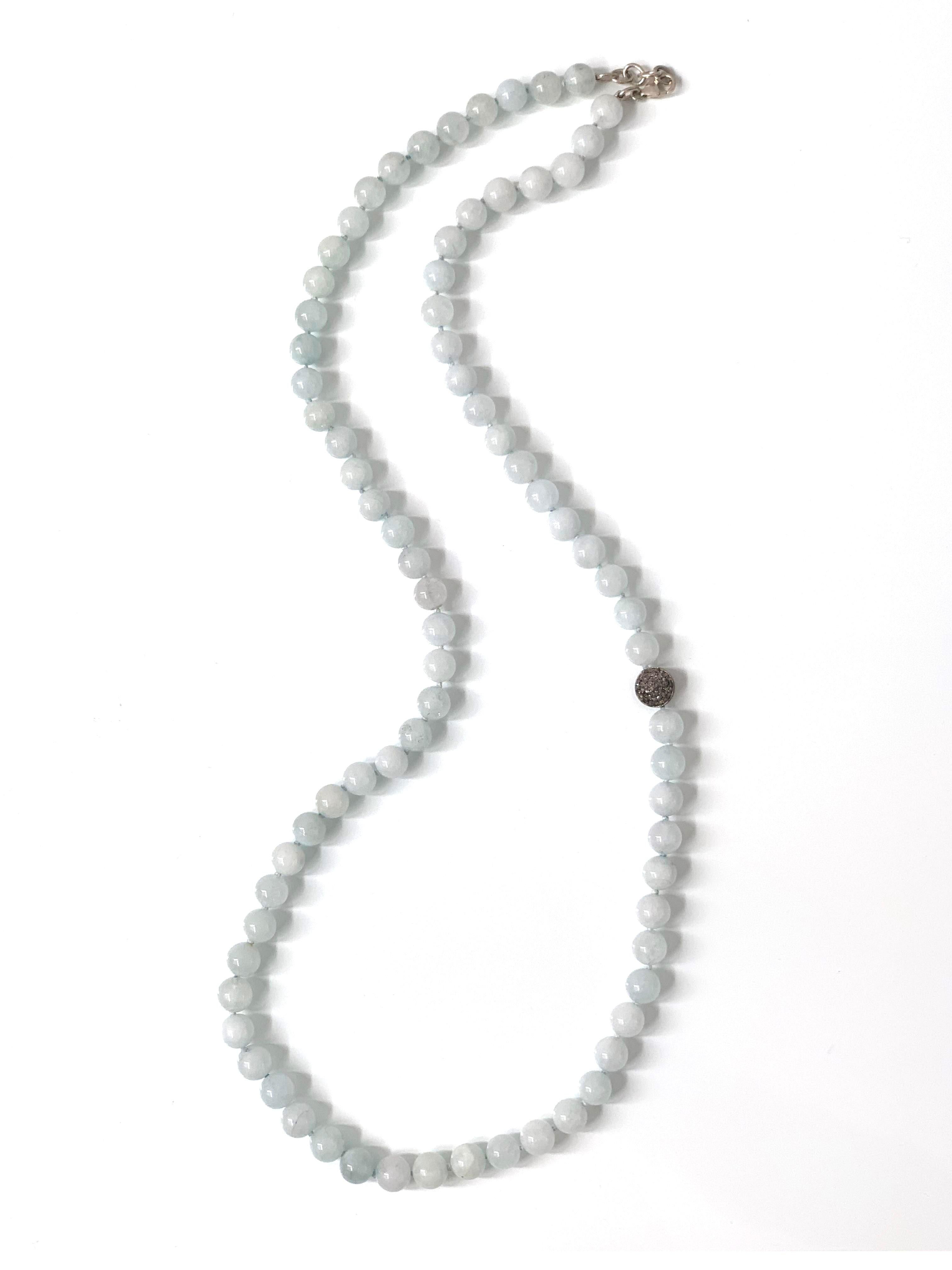 This beautiful pale blue African Aquamarine and Champagne Diamond bead necklace is the perfect addition to your jewelry collection. The African Aquamarine beads are 11mm diameter strung together with double-sided pave champagne diamond disc given