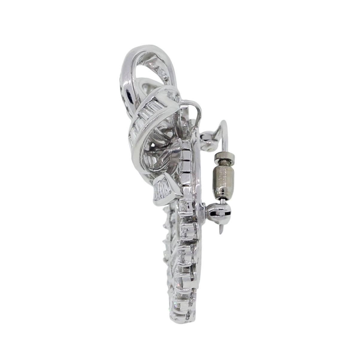 Natural Round Brilliant, Baguette and Emerald Cut Diamond Platinum Pin Brooch

Pins and brooches are pieces of jewelry that go great with any dress or winter coat. This brooch is an interesting estate piece, made with solid platinum and 4.75 carats